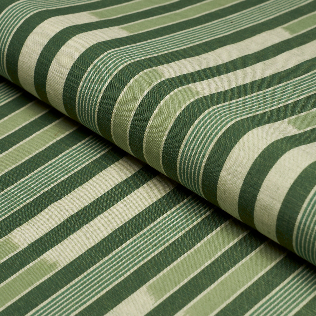 Cusco Ikat fabric in green color - pattern number 71973 - by Schumacher in the True Stripes collection