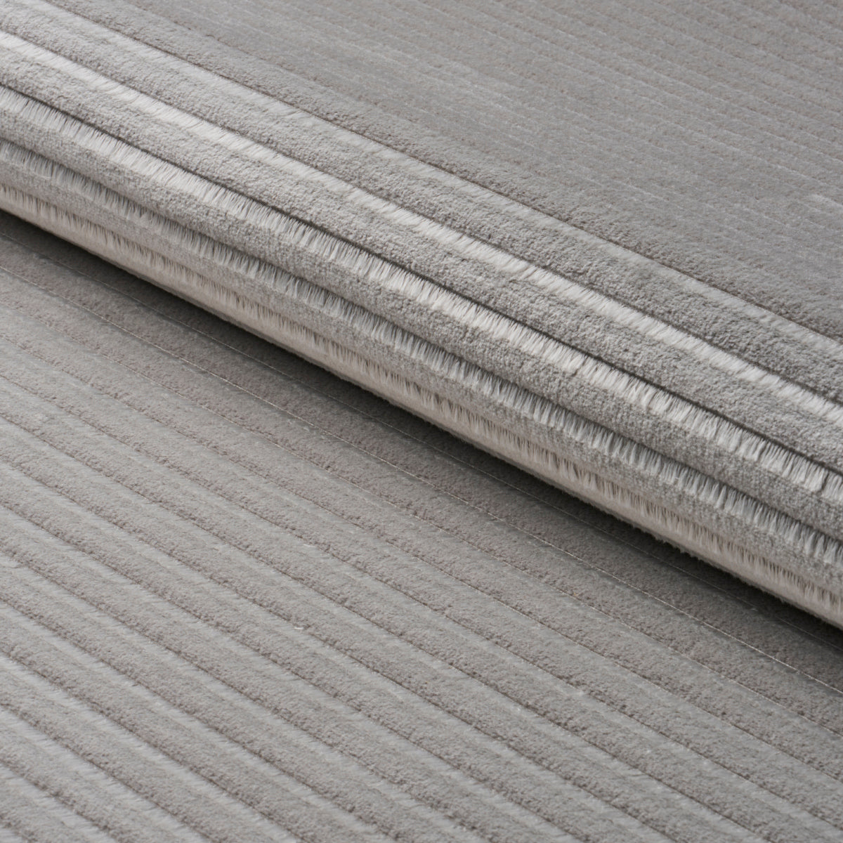 Petite Channeled Velvet fabric in otter grey color - pattern number 83302 - by Schumacher in the Patterson Flynn collection