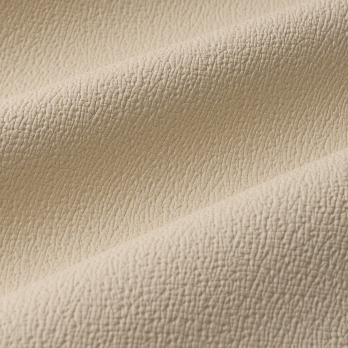 Textured Vegan Leather fabric in cream color - pattern number 87301 - by Schumacher in the Perfect Basics: Vegan Leather & Suede collection