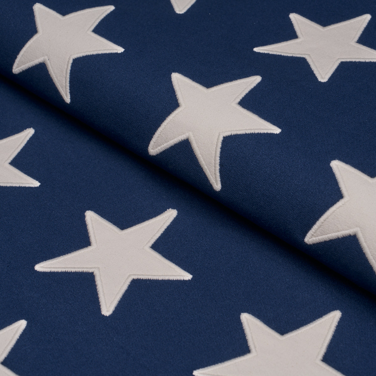 Starfield Applique fabric in Navy color - pattern number 87600 - by Schumacher in the Stars and Stripes collection
