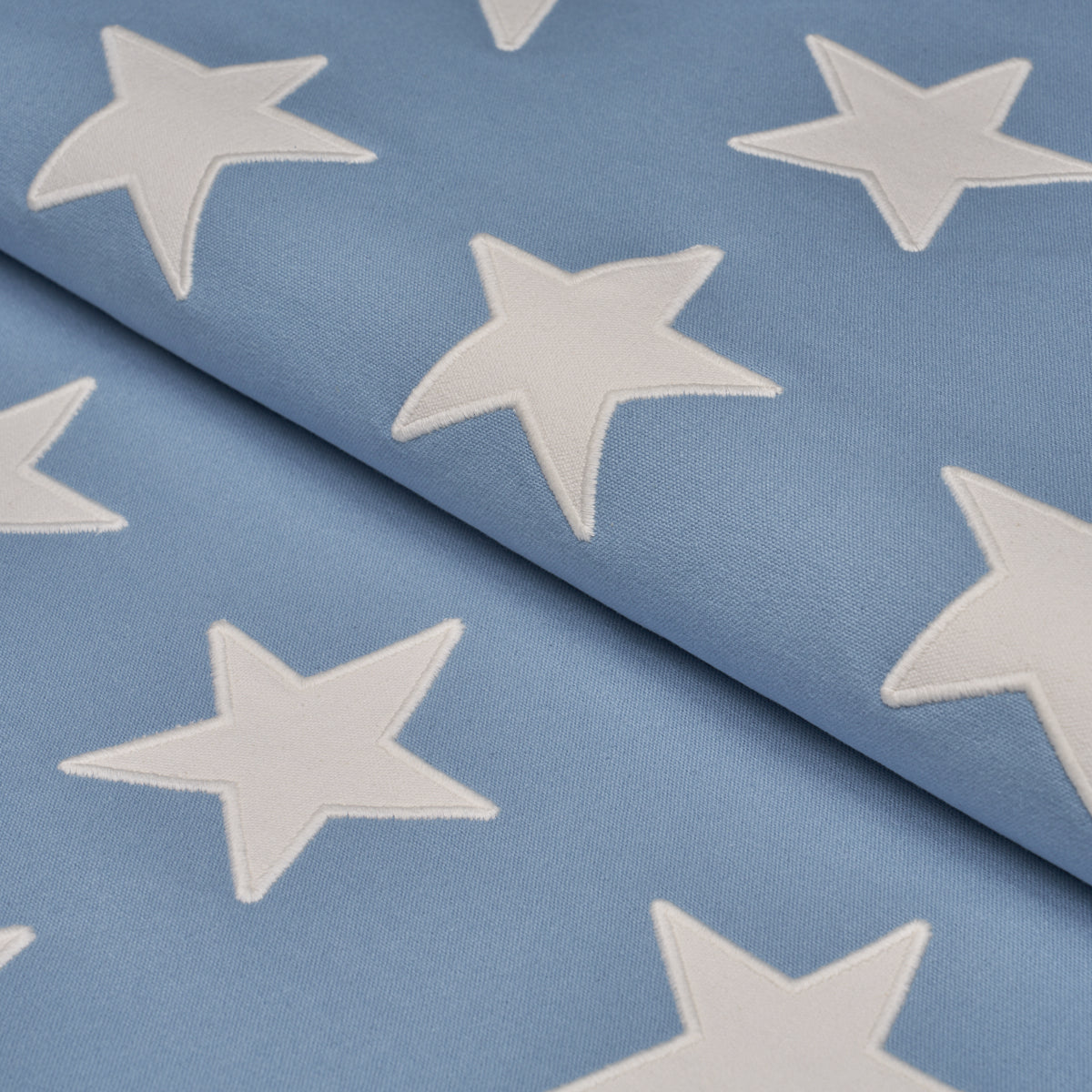 Starfield Applique fabric in Sky color - pattern number 87601 - by Schumacher in the Stars and Stripes collection