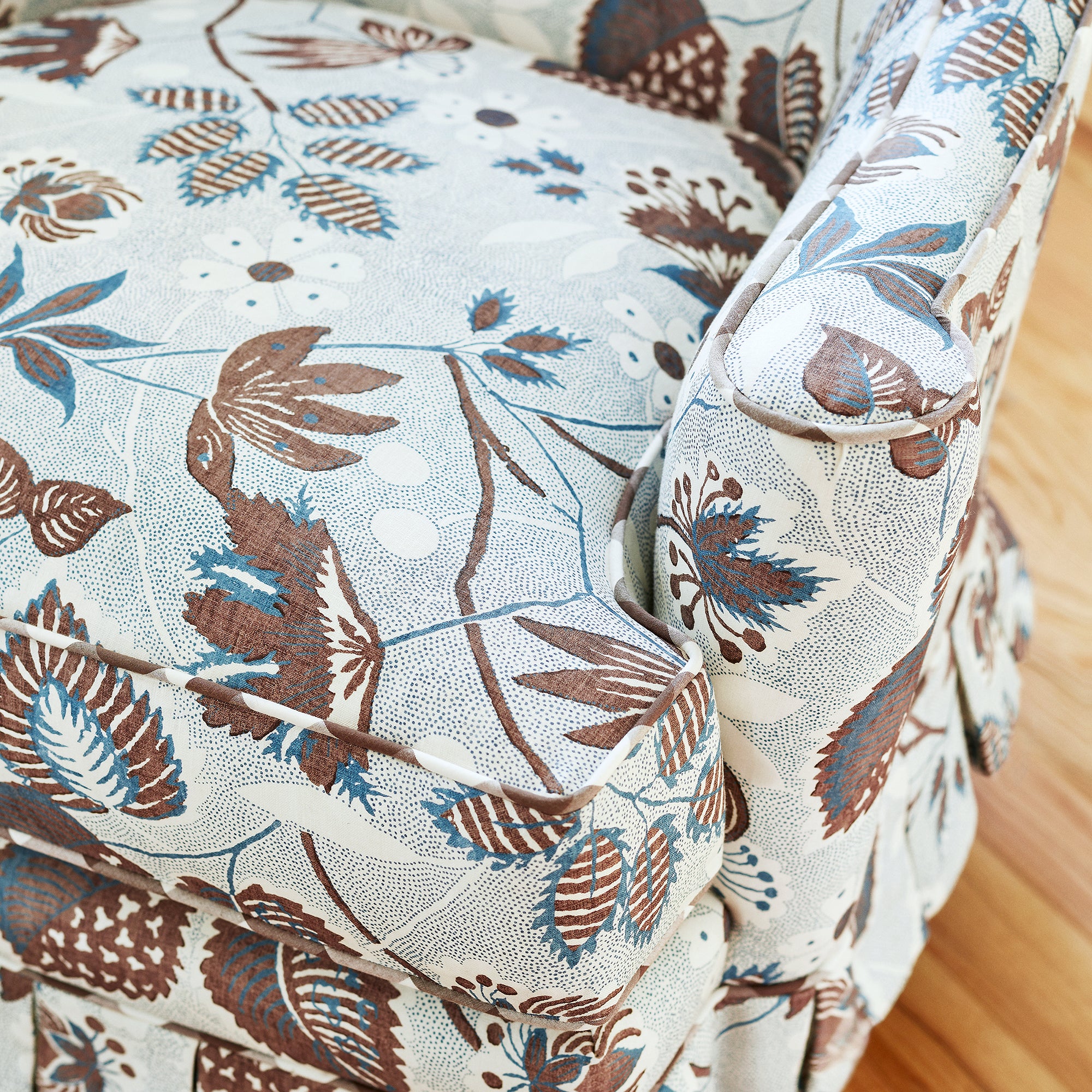Detail of Emerson Chair in Indienne Hazel printed fabric in Brown and Slate - pattern number AF15117 - by Anna French in the Antilles collection