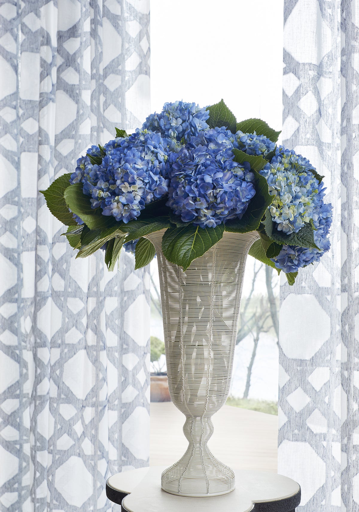 Sheer curtains made from Thibaut Cyrus Cane Sheer woven fabric in Navy color pattern FWW7134