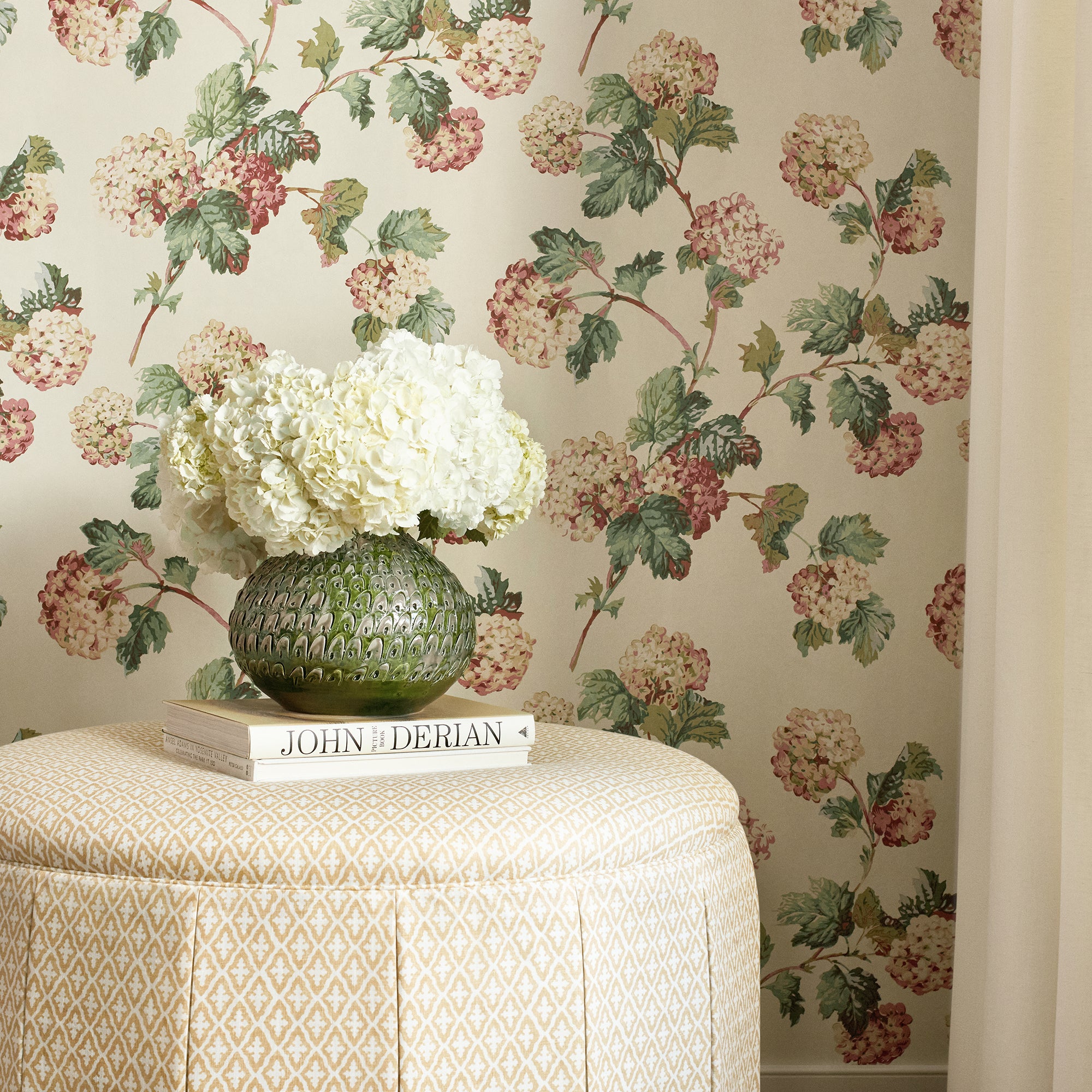Detailed view of Wyndham Ottoman in Lindsey printed fabric in soft gold color variant by Anna French in the Bristol collection - pattern number AF57812