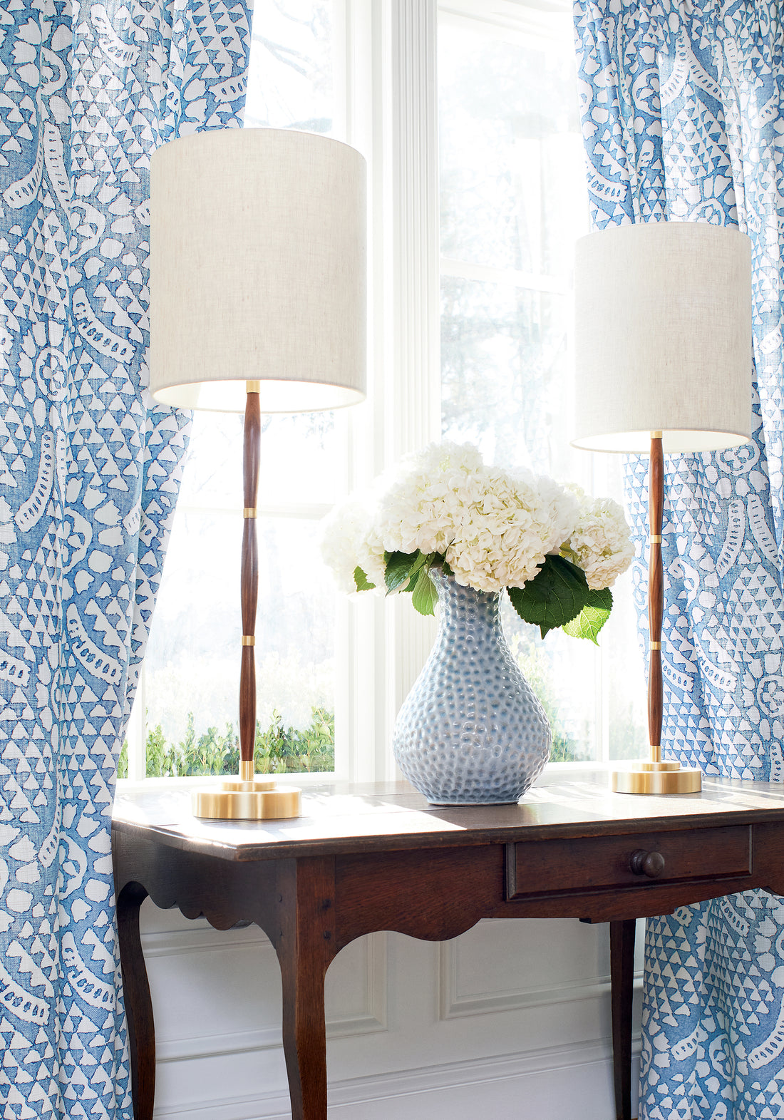 Drapery curtains made with Thibaut Chamomile fabric in blue and white color - pattern number F914314