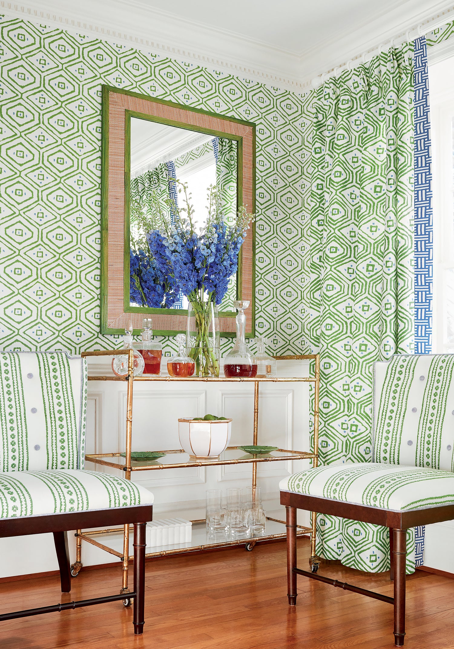 Living room with stirling dining chairs upholstered in Thibaut new haven stripe printed fabric in green color, pattern F910607