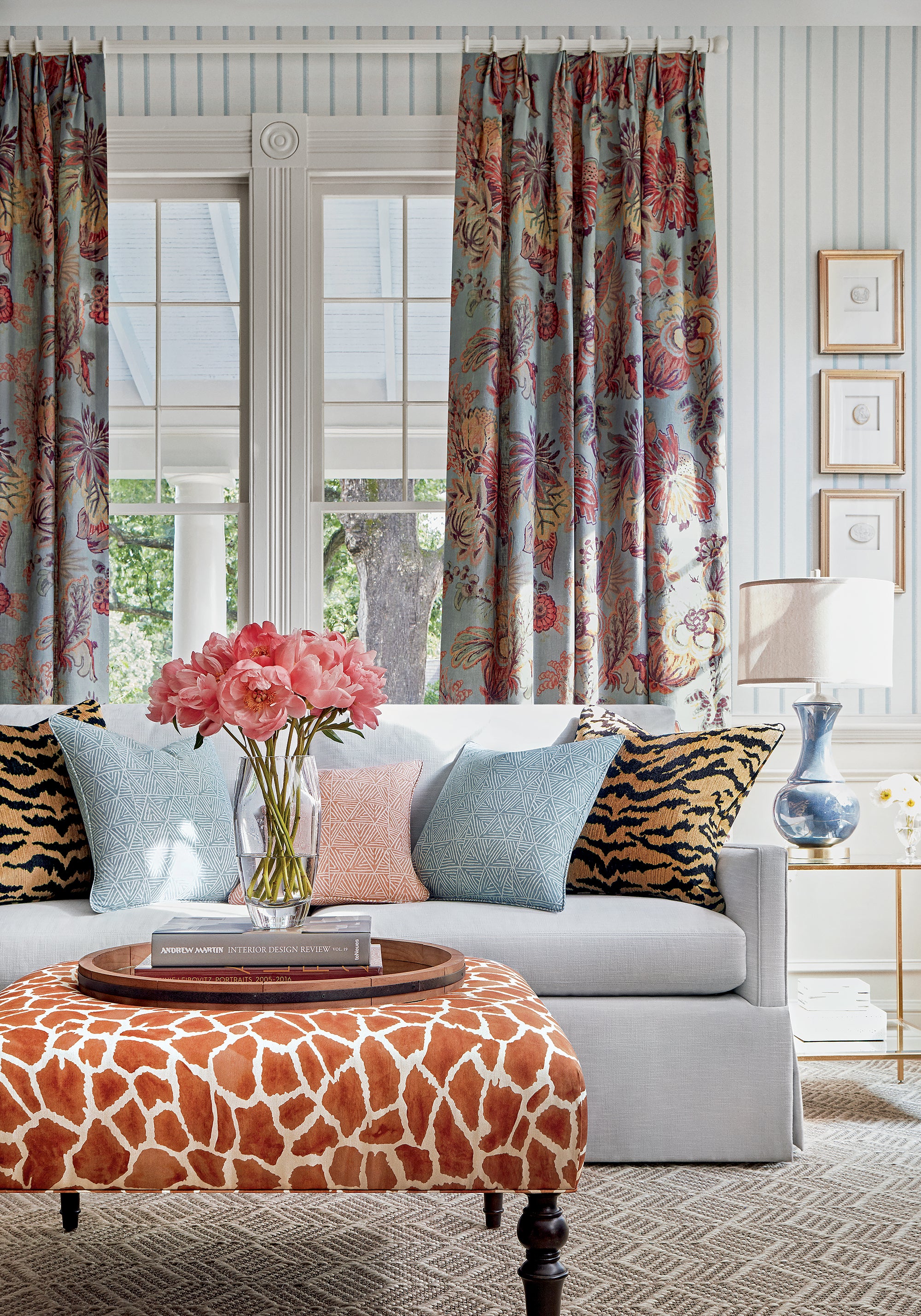 Detailed view of drapery in Floral Gala printed fabric in slate blue and cinnamon color variant by Thibaut in the Colony collection - pattern number F910215
