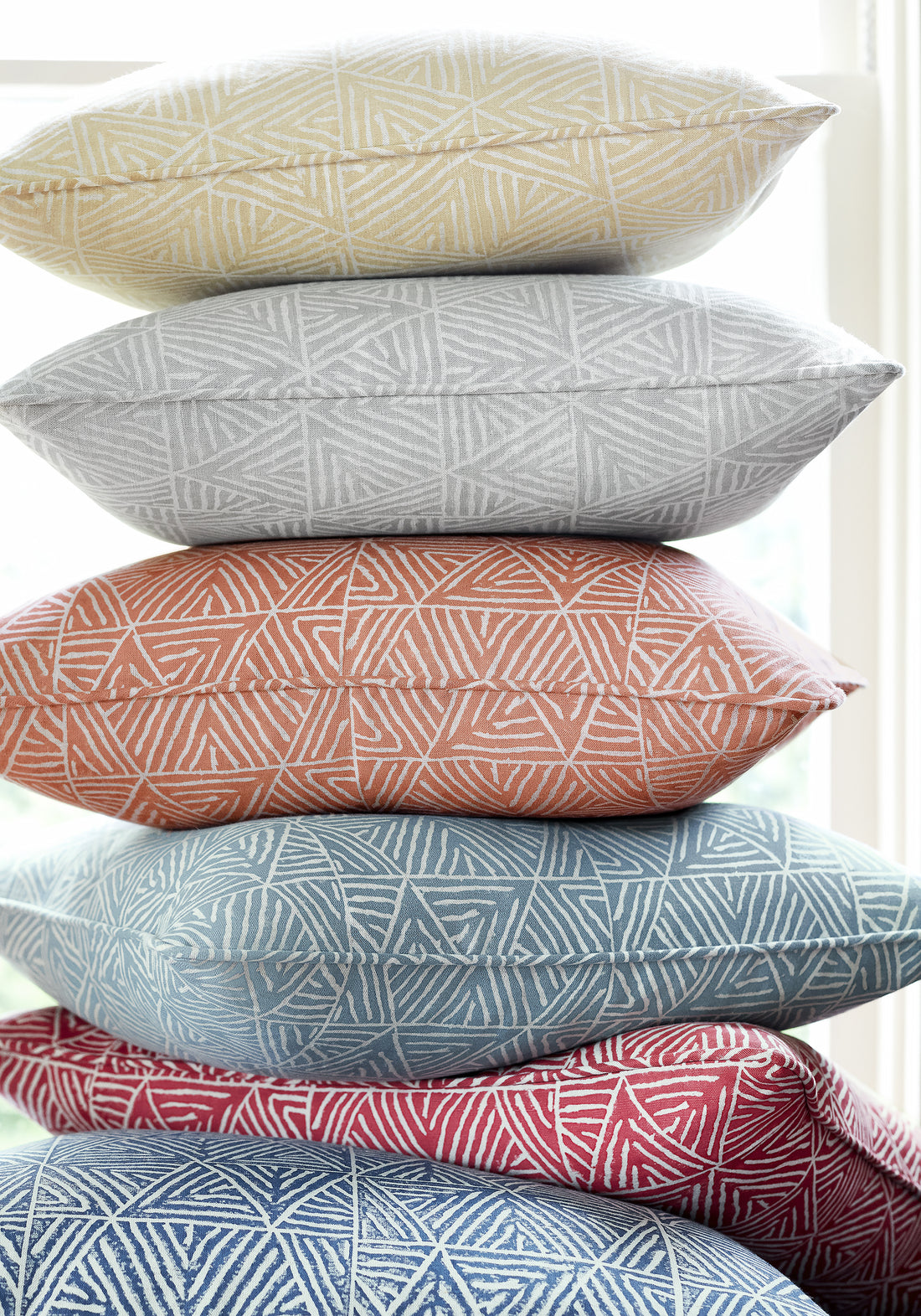Collection of pillows in Mombasa printed fabric featuring cinnamon color fabric - pattern number F910208 - by Thibaut in the Colony collection