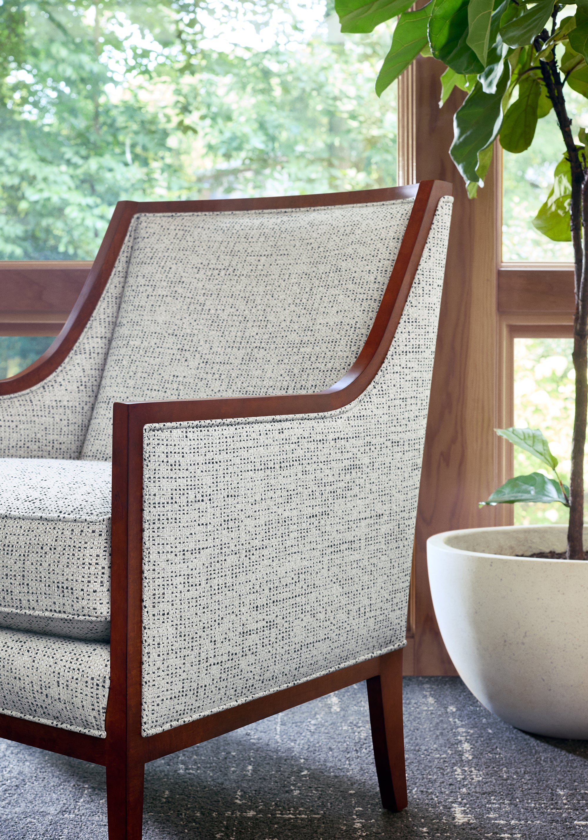 Closeup view of Chair upholstered in Arno fabric in ebony color - pattern number W80950 - by Thibaut fabrics