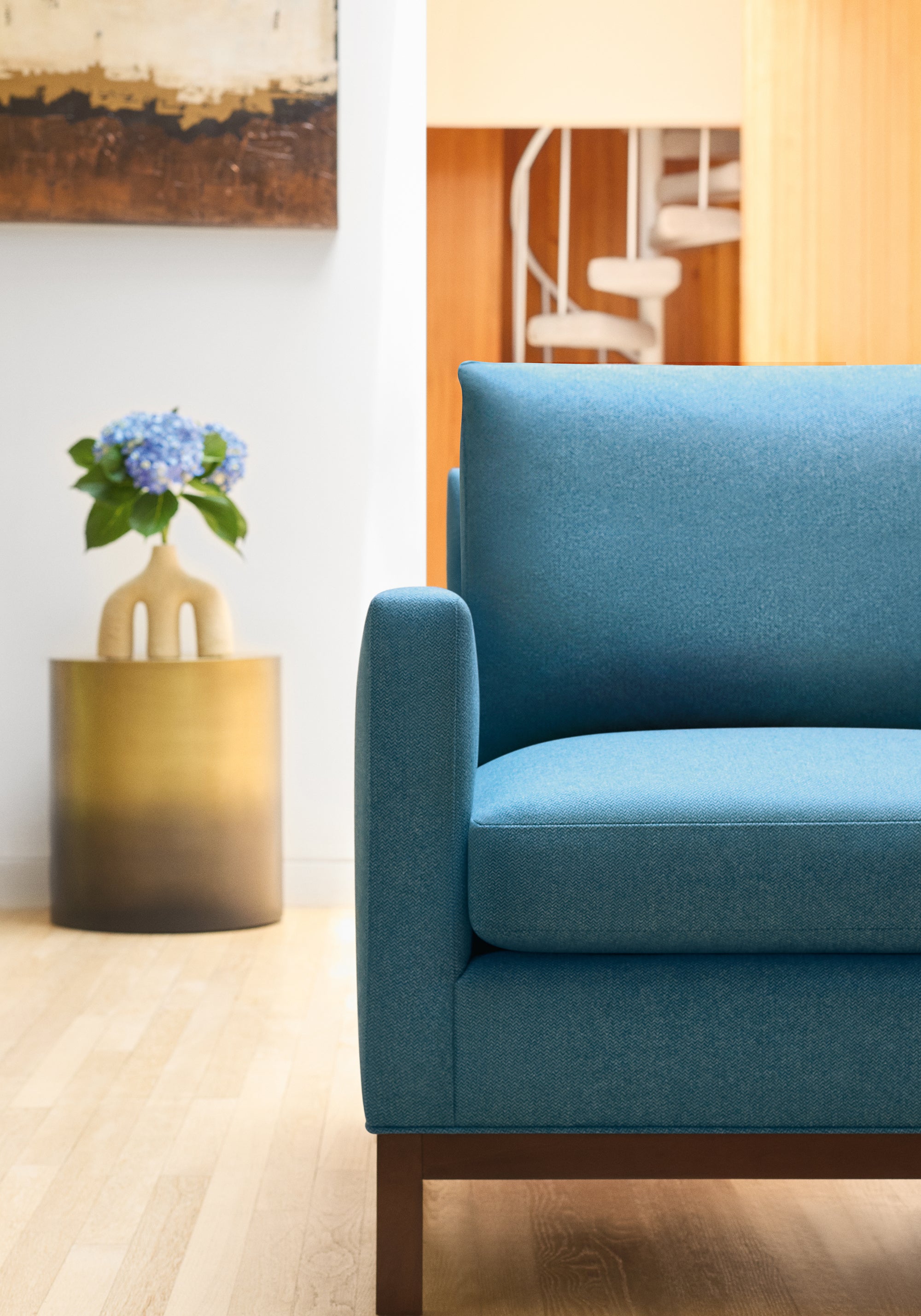 Modern living room with Frampton Chair in Dorset woven fabric in Lagoon color - pattern number W80912 - by Thibaut fabrics