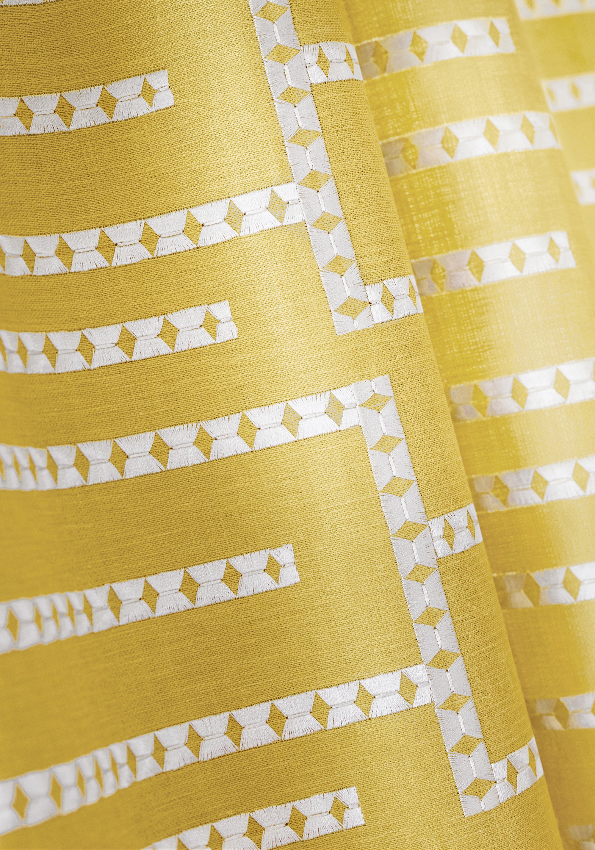 Detailed view of Architect Embroidery woven fabric in harvest gold color of the Grand Palace collection by Thibaut - pattern number W713632