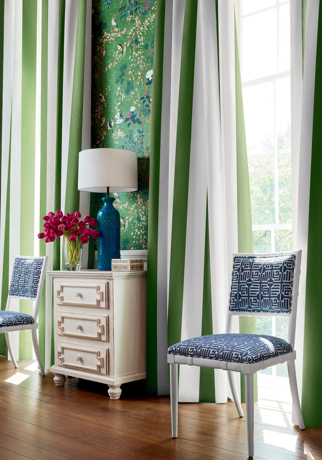 Living room with draperies made with Thibaut Bergamo Stripe fabric in emerald