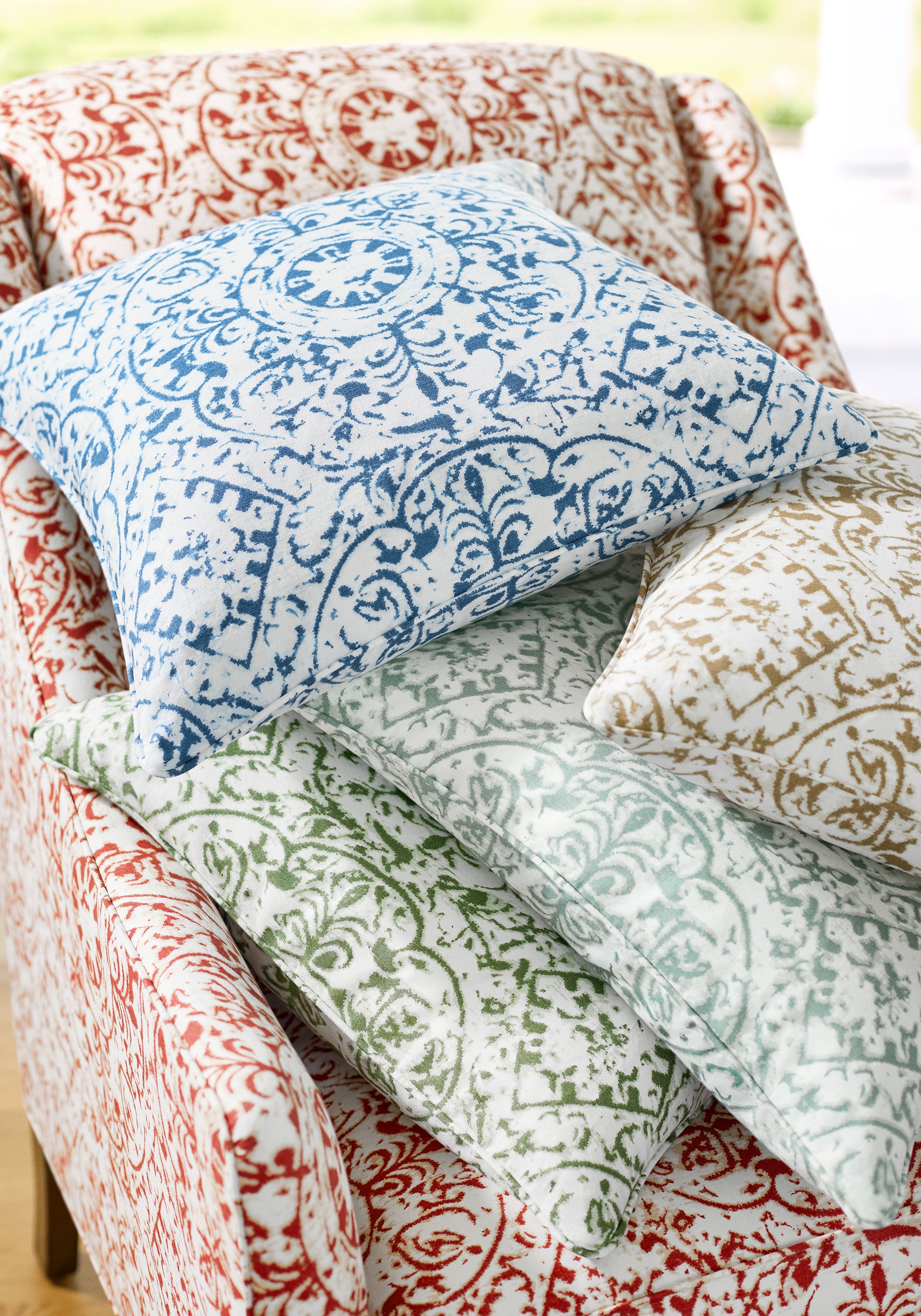 Chair and pillows featuring Havana fabric in sunbaked color - pattern number F981314 - by Thibaut in the Montecito collection