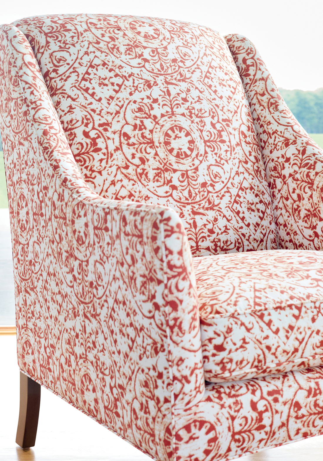 Chair upholstered in Havana fabric in sunbaked color - pattern number F981314 - by Thibaut fabric