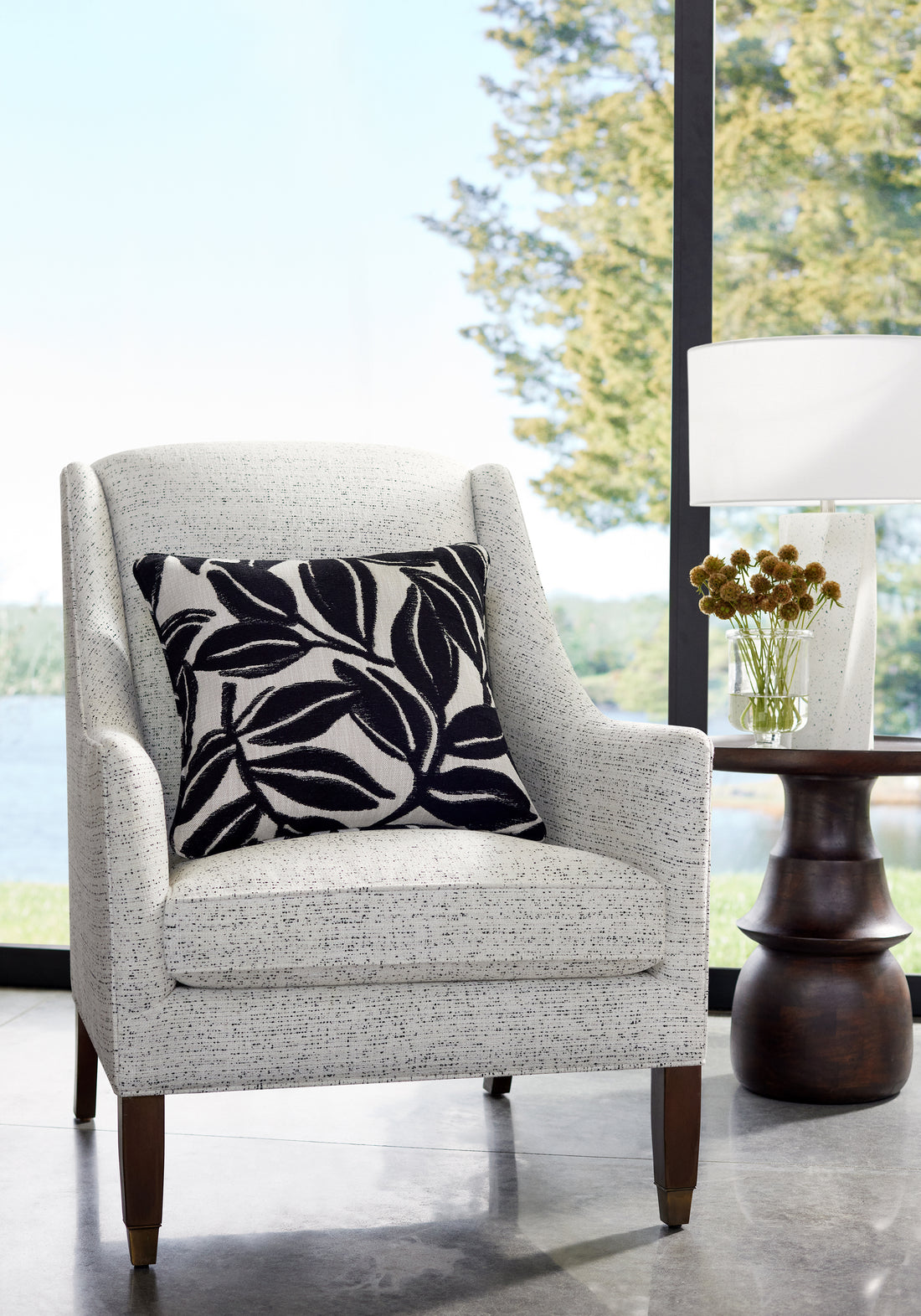 Pillow featuring Kona fabric in ebony color - pattern number W8815 - by Thibaut in the Haven collection