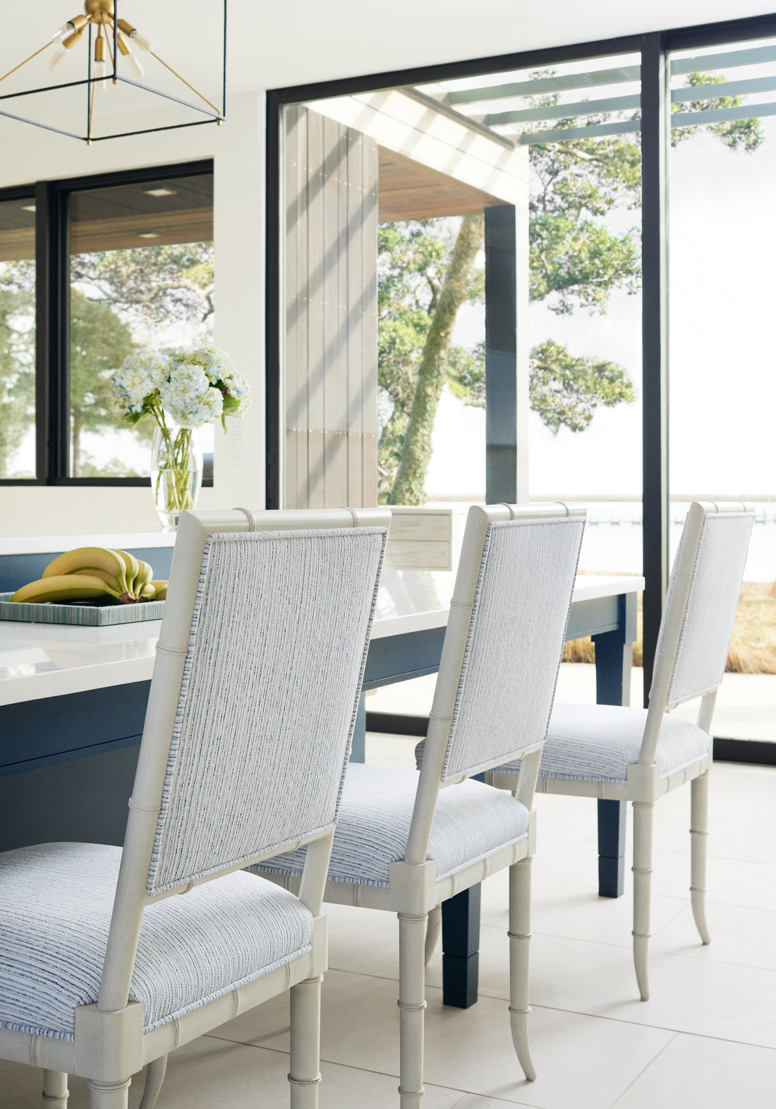 Dining chairs featuring Zia Stripe fabric in sky color - pattern number W8806 - by Thibaut in the Haven collection