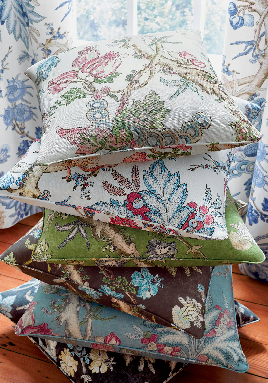 Drapery and collection of pillows in Chatelain printed fabric featuring blue and red color fabric - pattern number F910845 - by Thibaut in the Heritage collection