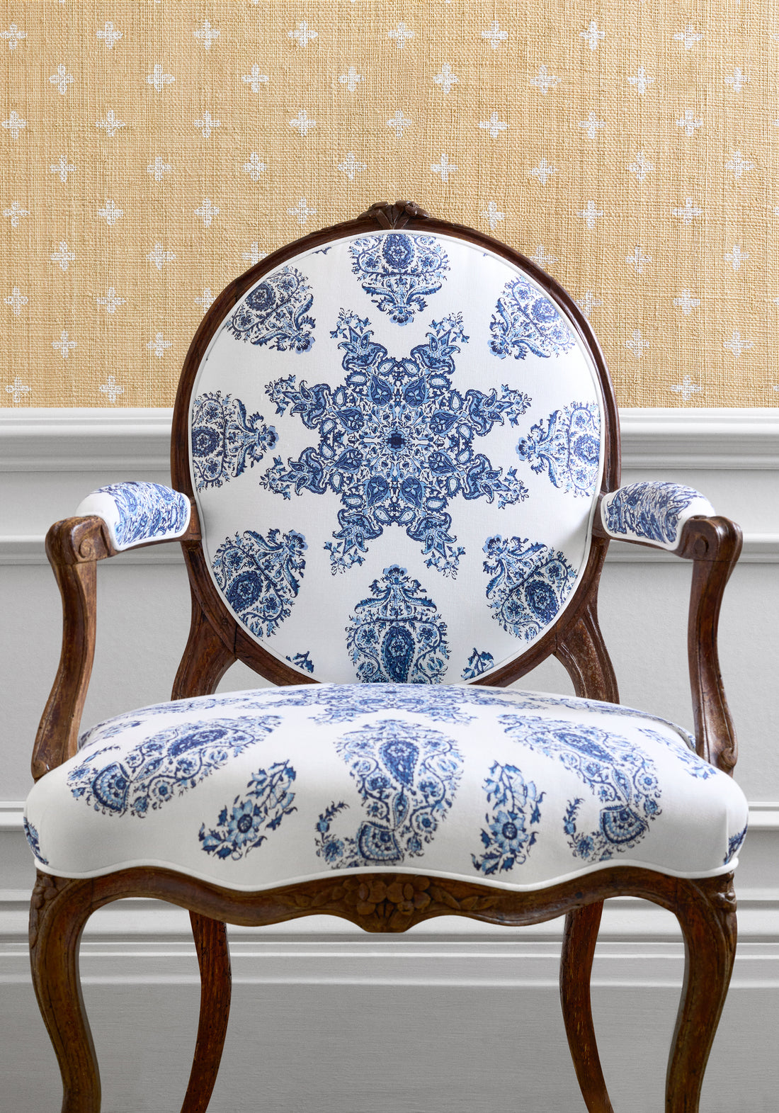 Chair upholstered with East India fabric in blue and white color - pattern number F936429 - by Thibaut in the Indienne collection