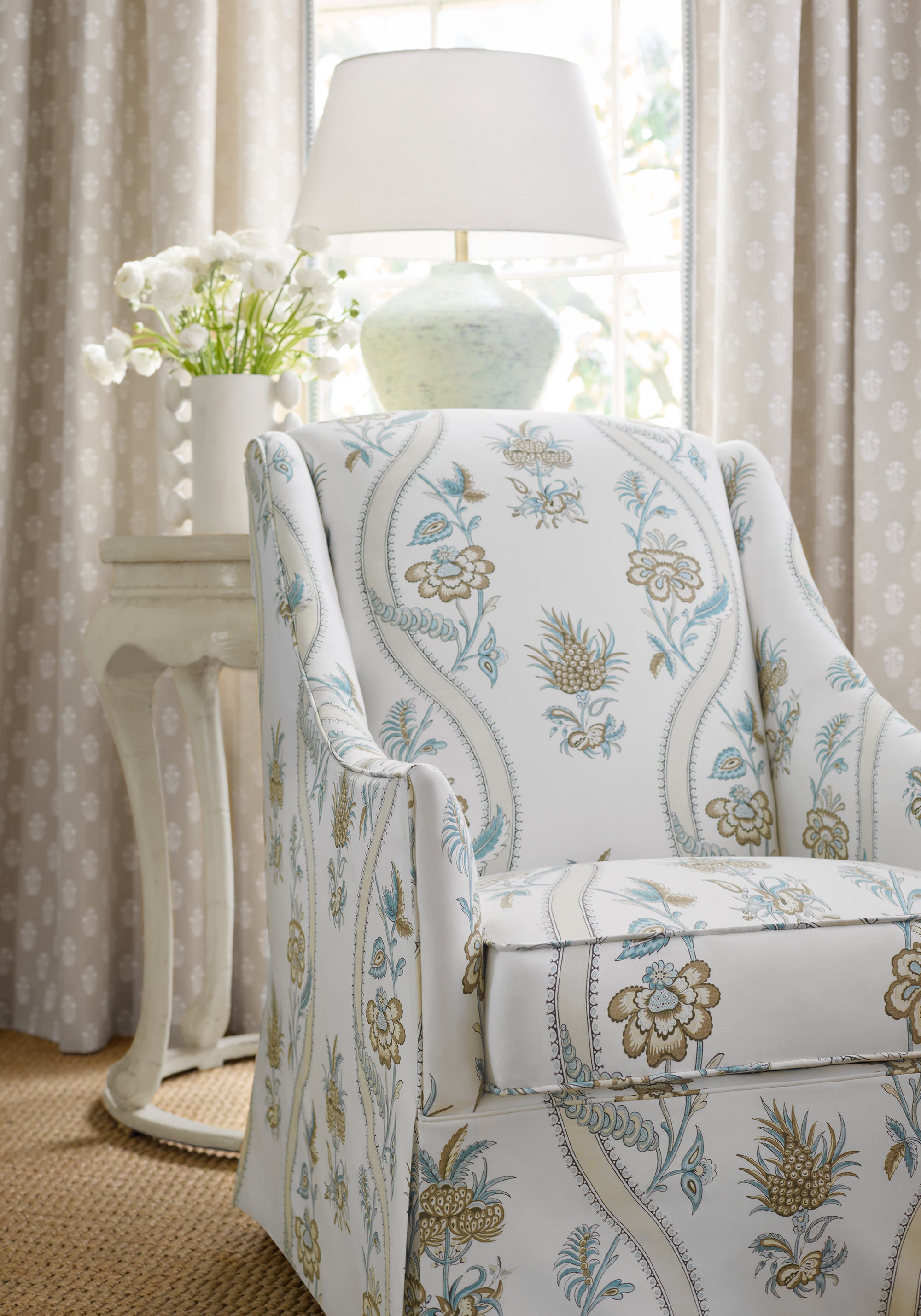 Indoor chair featuring Ribbon Floral fabric in beige and spa blue color - pattern number F936425 - by Thibaut in the Indienne collection