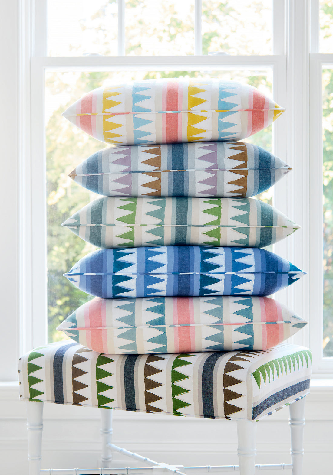 Color series showing pillow made with Lomita Stripe fabric in green and blue color - pattern number F916236 - by Thibaut fabrics