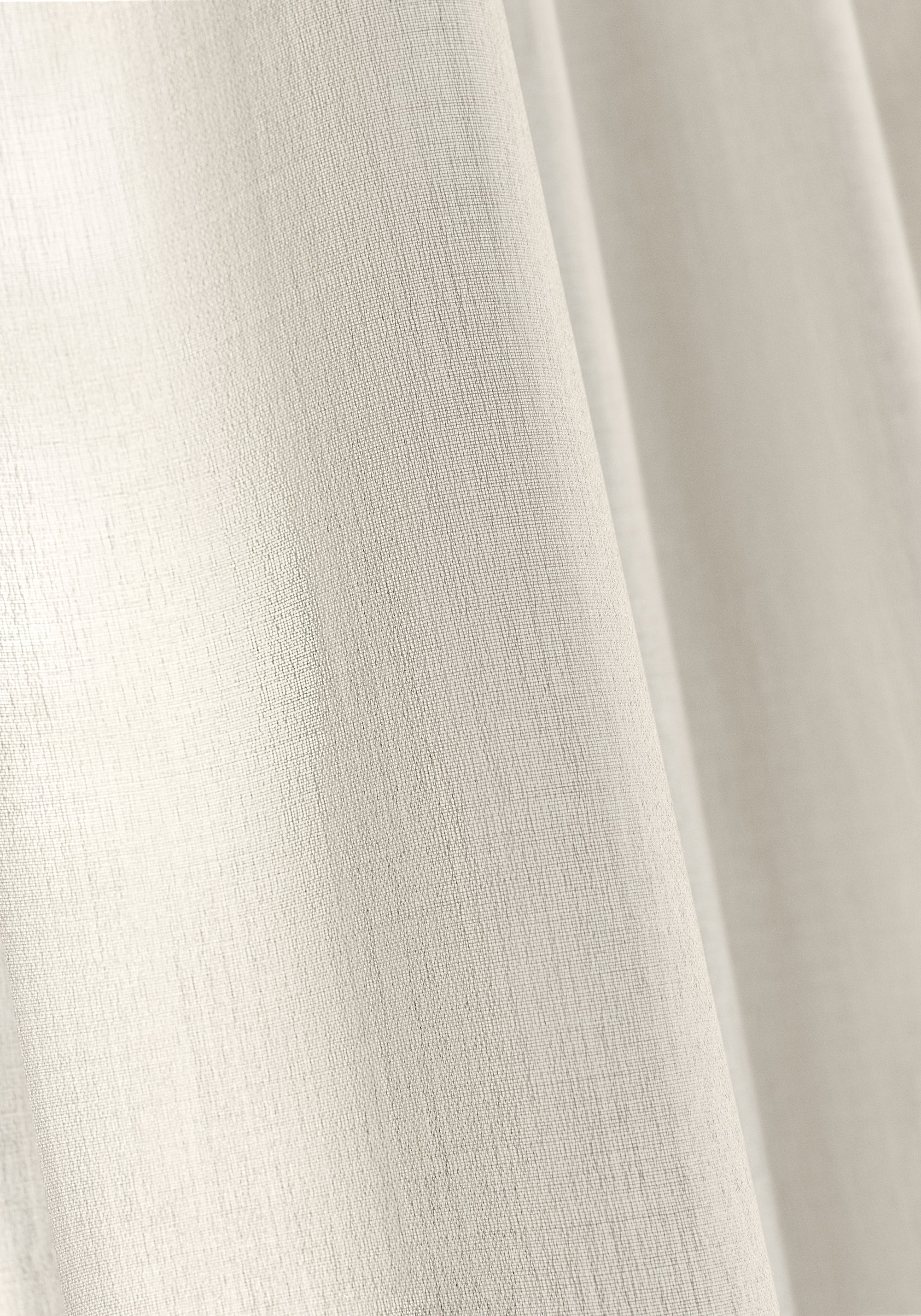 Closeup detail of curtains made using Daphne fabric in flax color - pattern number FWW81730 - by Thibaut fabrics
