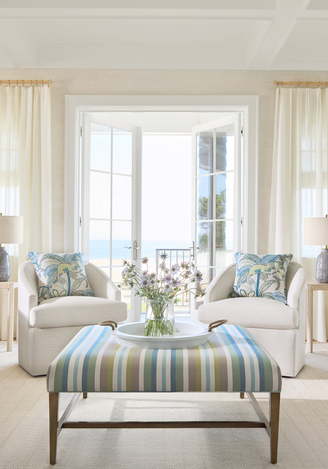 Living room with drapery panels in Asher woven fabric in natural color by Thibaut fabrics
