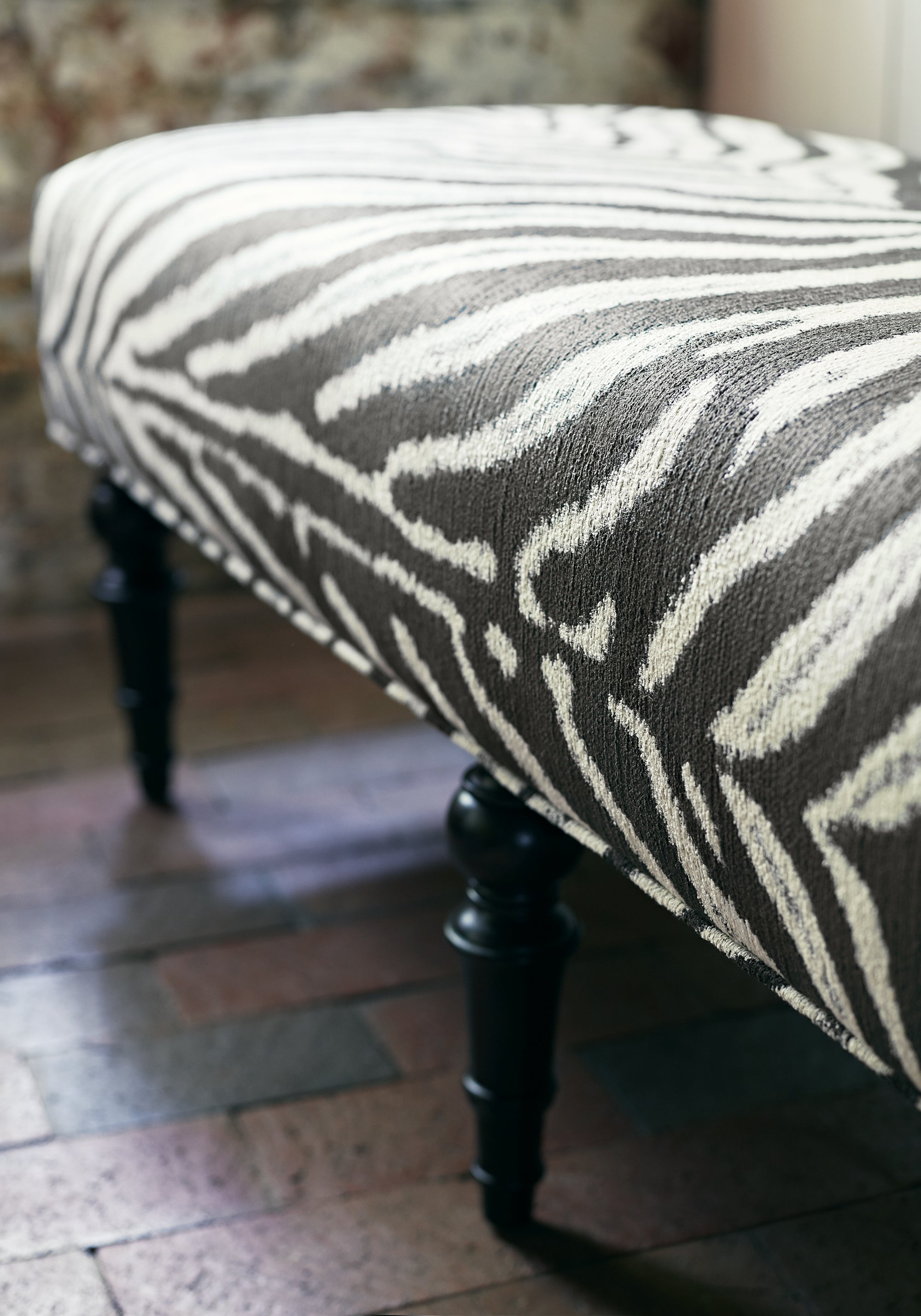 Detailed view of Baxter Ottoman in Zamira woven fabric in black color - pattern number W80438 by Thibaut in the Woven Resource Vol 10 Menagerie collection