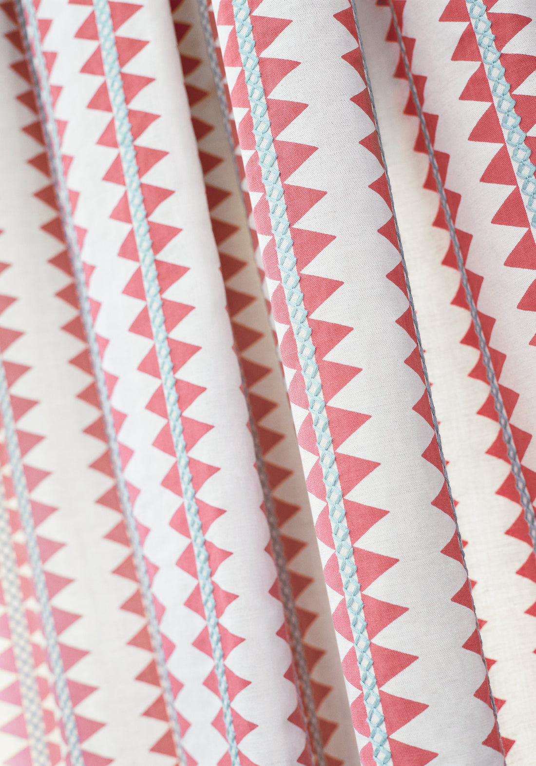 Detailed Reno Stripe Embroidery woven fabric in coral color, pattern number W713245 of the Thibaut Mesa collection