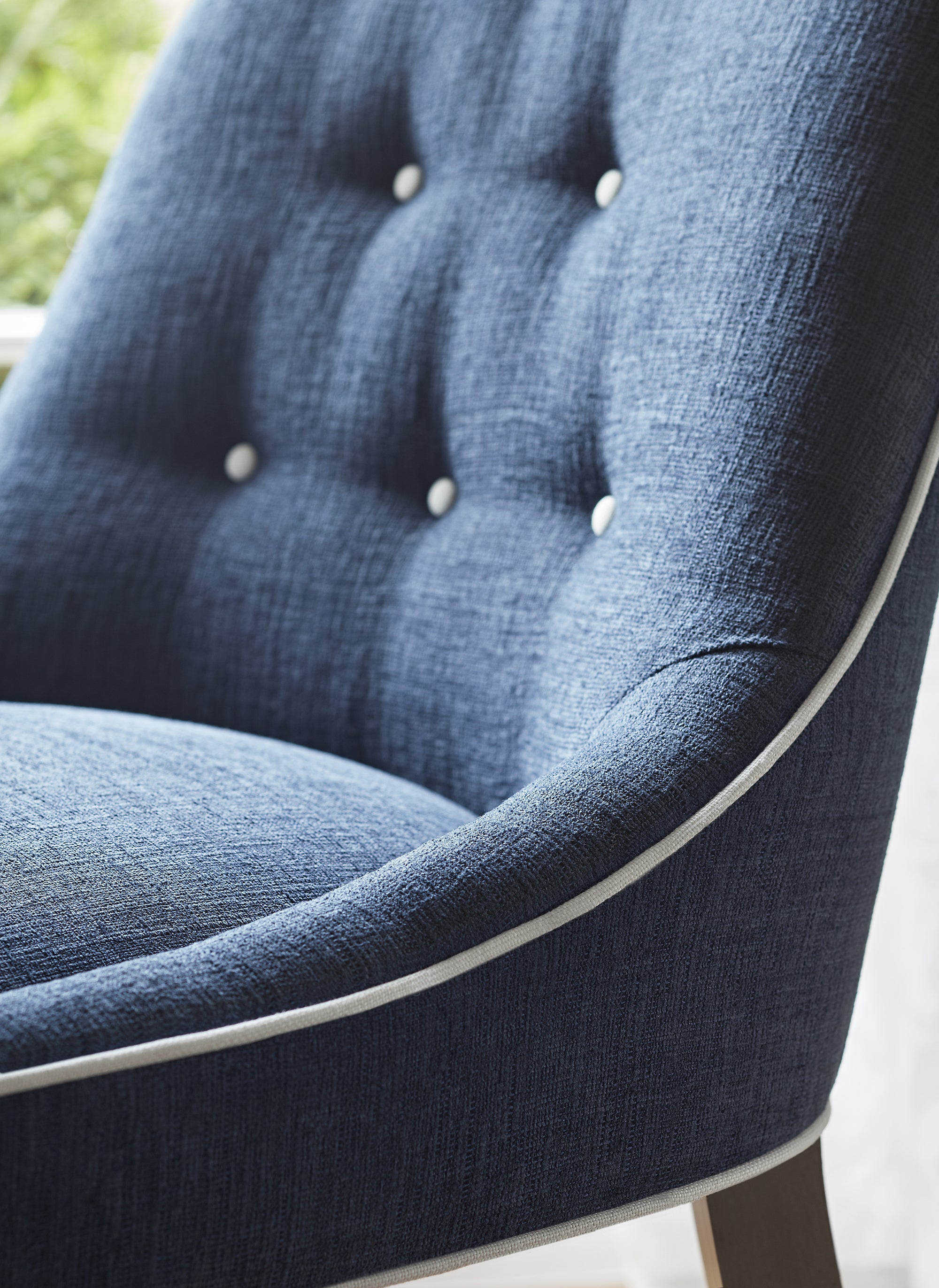 Detailed view of Melrose Dining Chair in Montage woven stain resistant fabric in navy color variant by Thibaut in the Mosaic collection - pattern number W80480