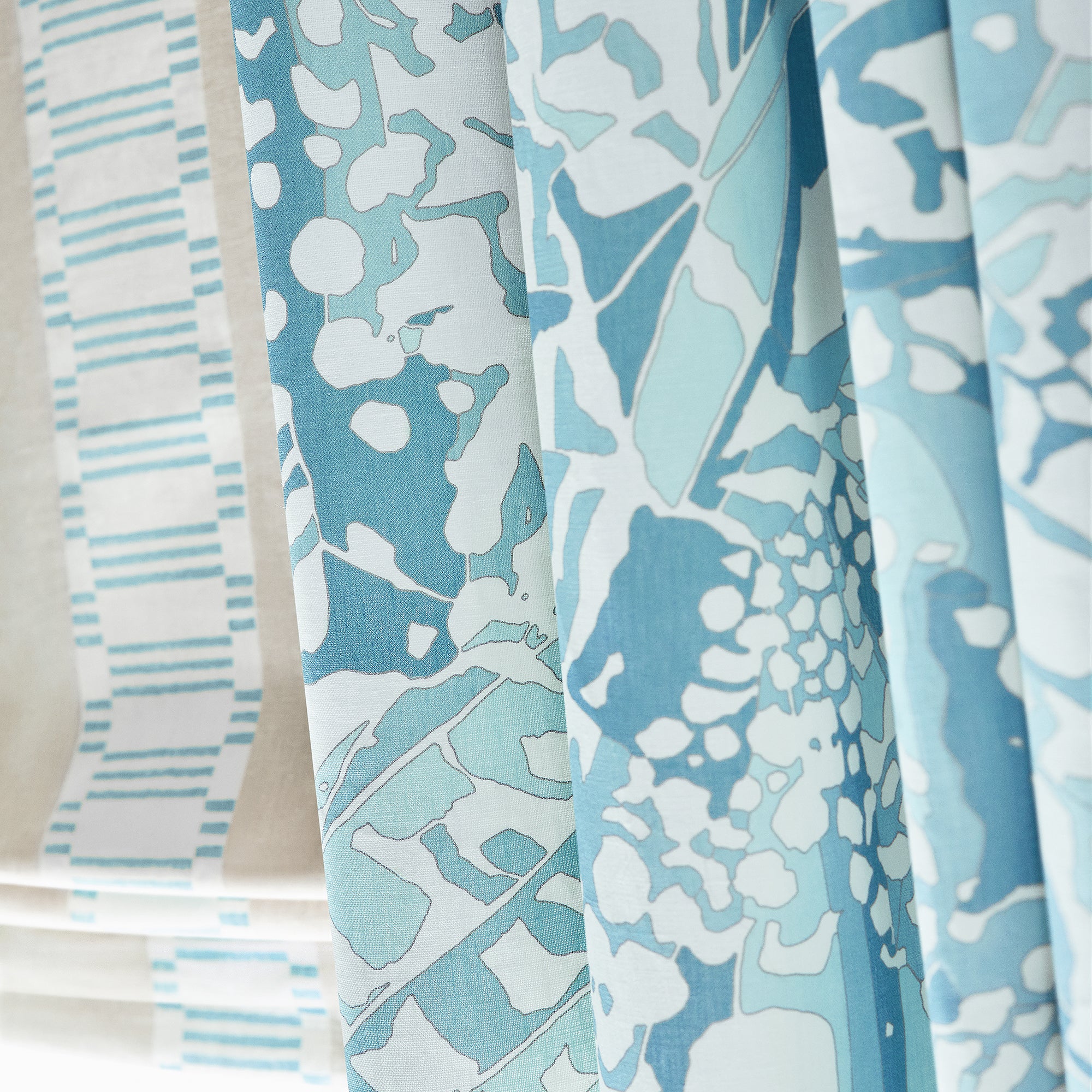 Detail of draperies in Puccini fabric in robins egg color - pattern number AF9860 - by Anna French in the Nara collection