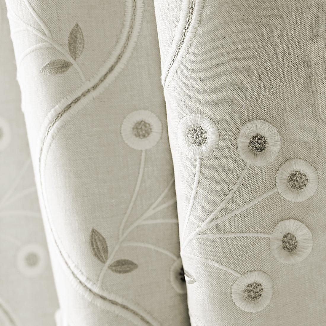 Closeup of draperies made from Olympus Embroidery fabric in natural color - pattern number AW9100 - by Anna French