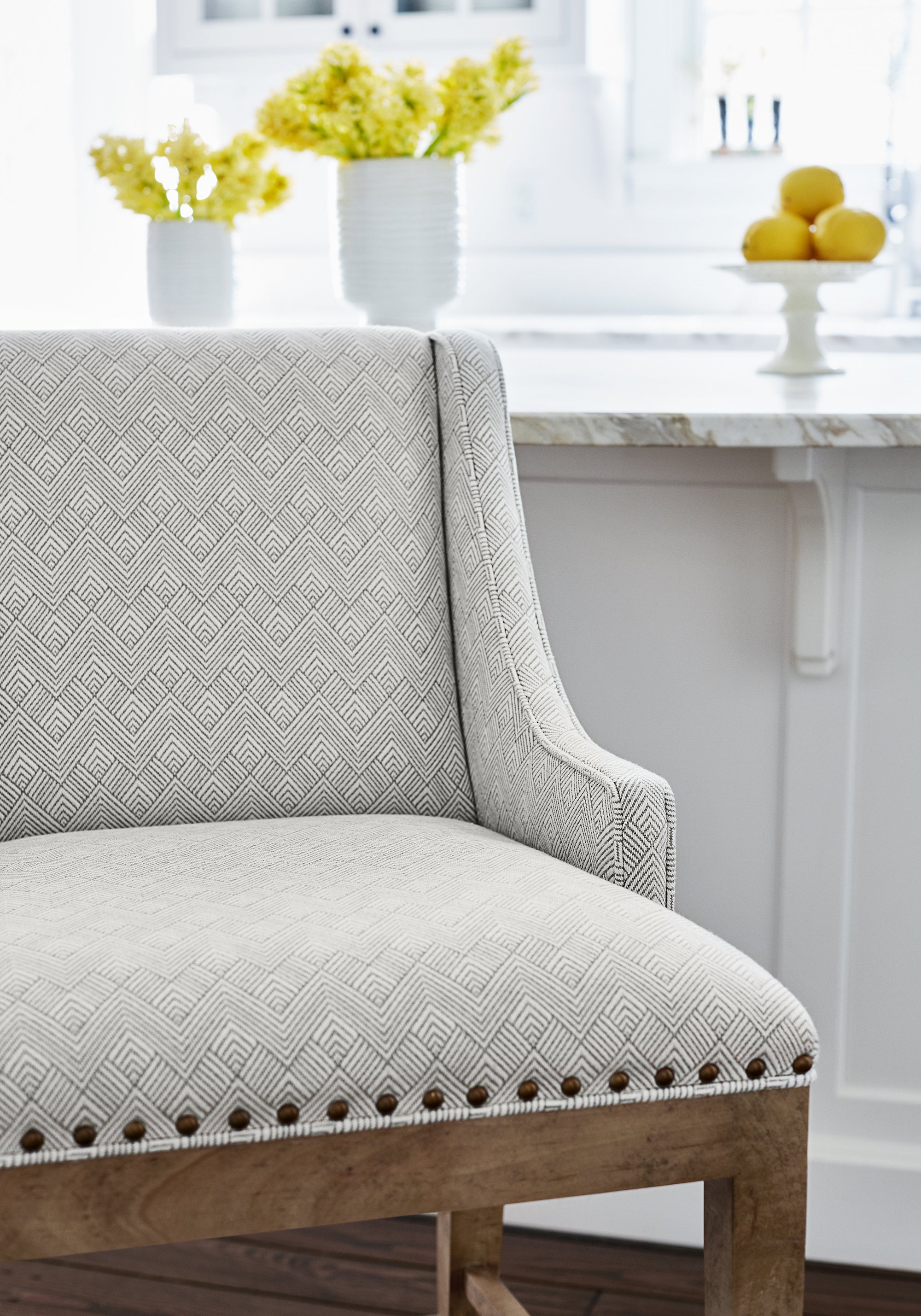 Detailed view of Hudson Dining Chair in Maddox woven fabric in jute color variant by Thibaut in the Nomad collection - pattern number W73333
