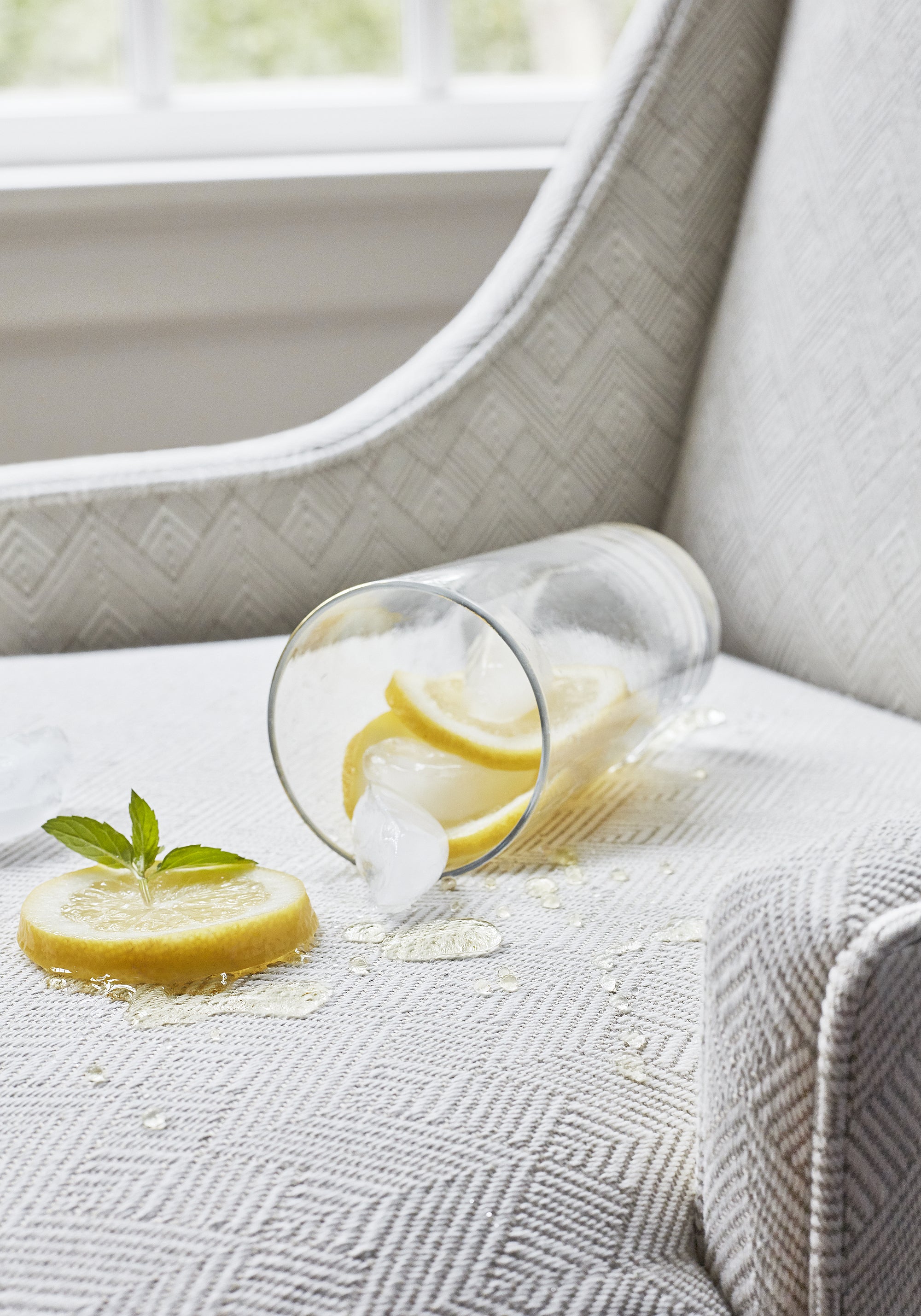 Lemonade spilled on stain resistant Maddox woven fabric - pattern number W73333 in jute color by Thibaut in the Nomad collection