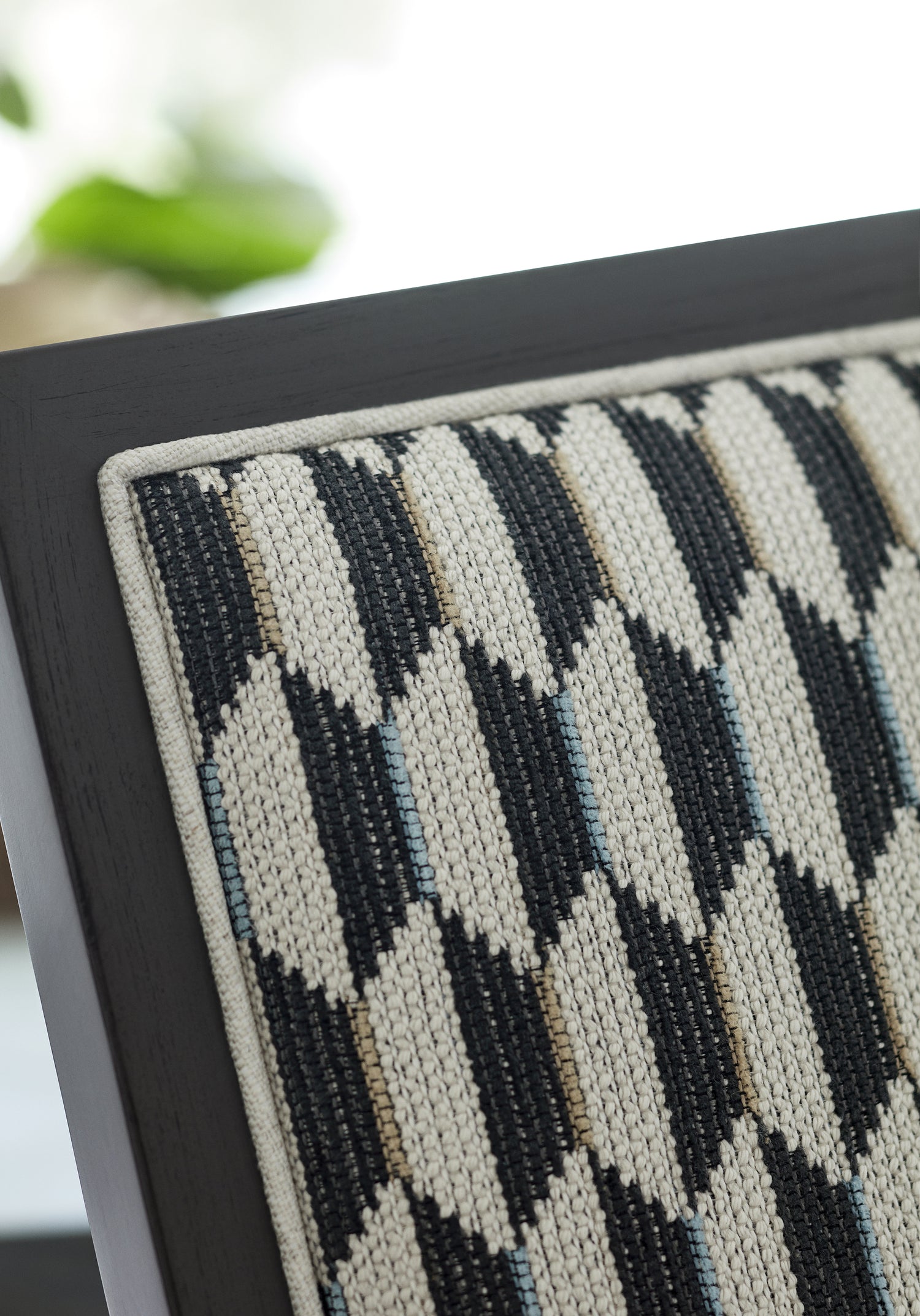Detailed Optica woven fabric in charcoal color, pattern number W73353 of the Thibaut Nomad collection