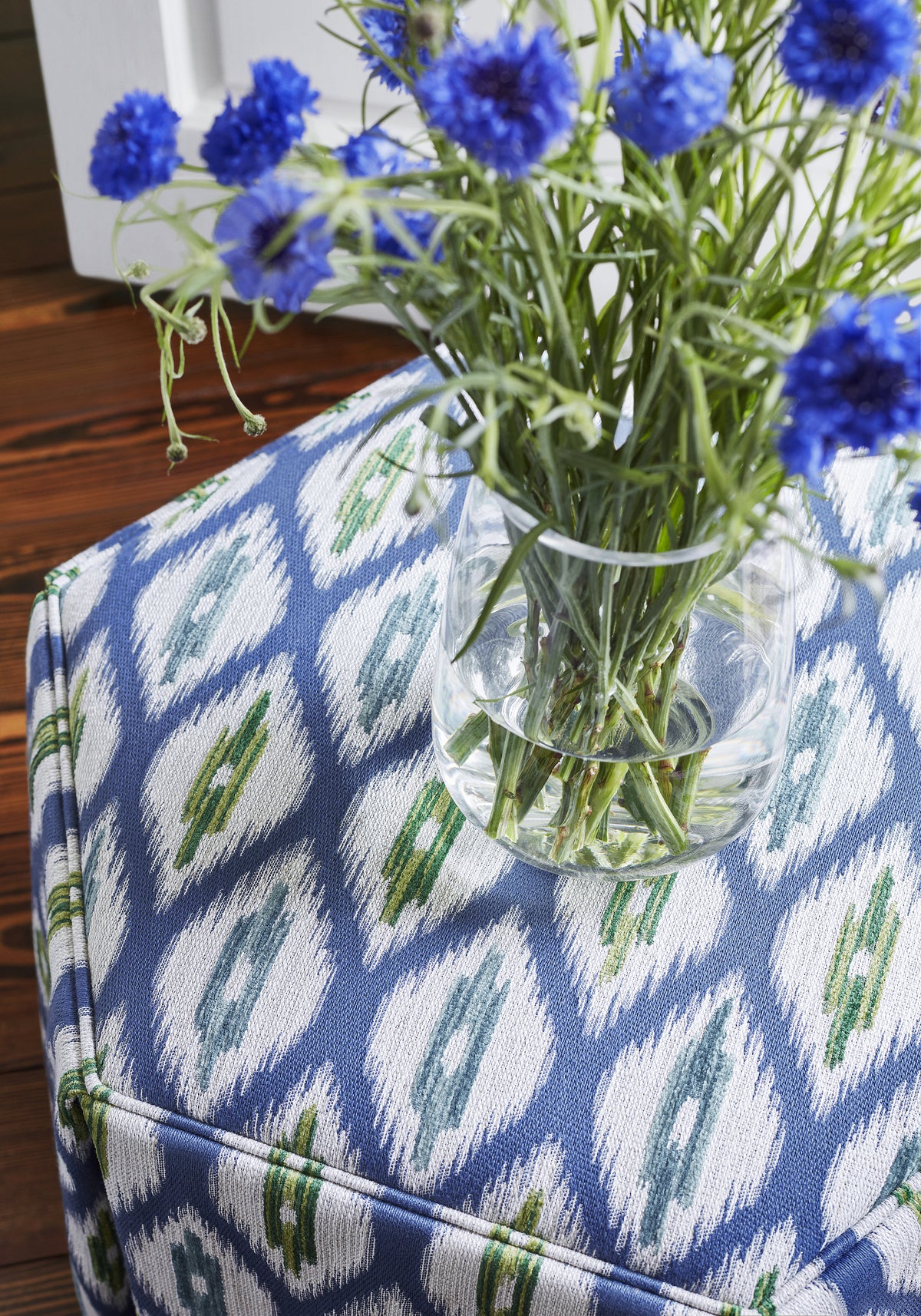 Detailed view of For the Hex of it Ottoman in Rajah woven fabric in marine blue color variant by Thibaut in the Nomad collection - pattern number W73361
