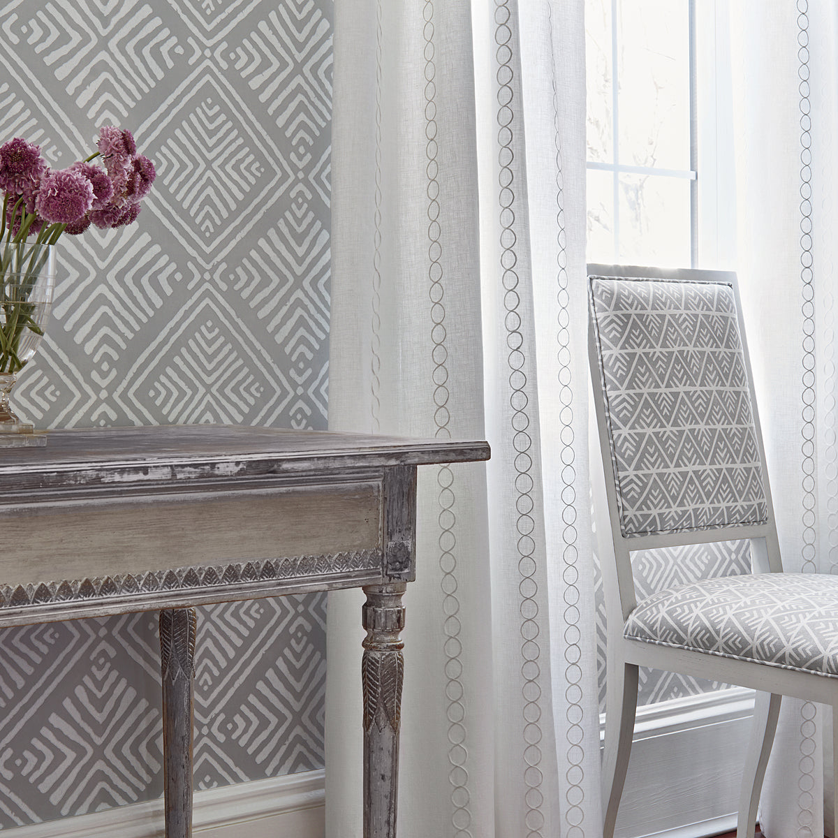 Side view of Lauderdale Chair in Jules printed fabric in Grey on White - pattern number AF78702 - by Anna French