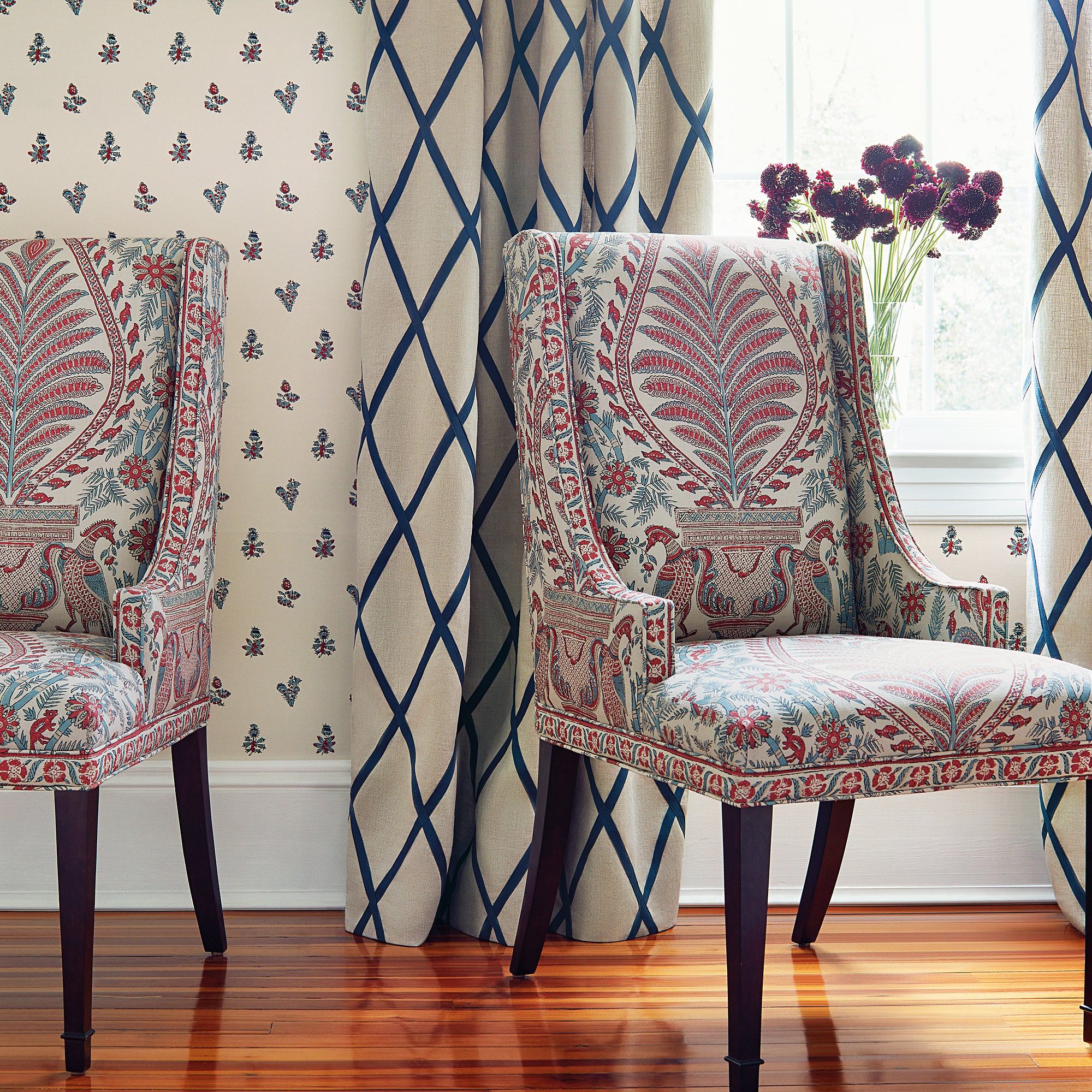 Room with draperies made with Tarascon Trellis Applique fabric in navy on natural color - pattern number AW78713 - by Anna French