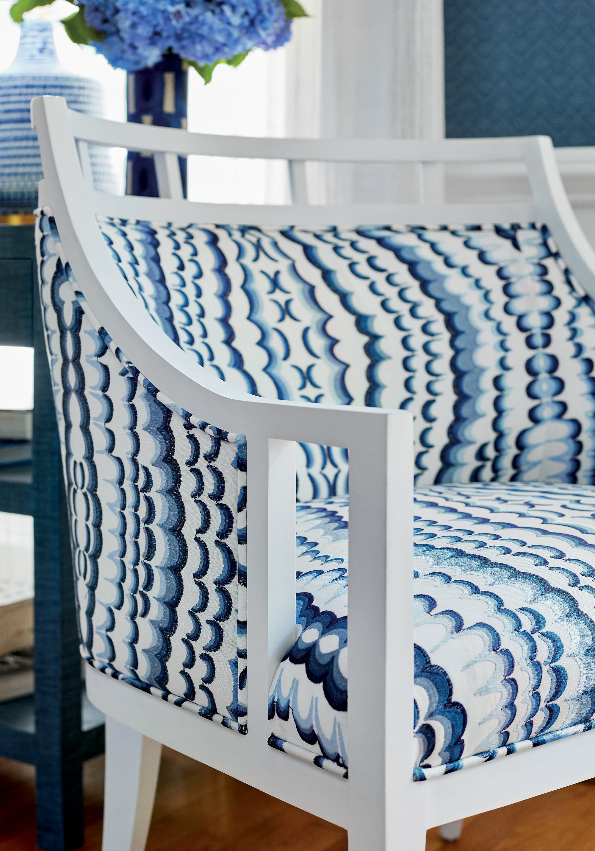 Detailed view of Malibu Chair in Ebru Embroidery woven fabric in blue color variant by Thibaut in the Paramount collection - pattern number W72982