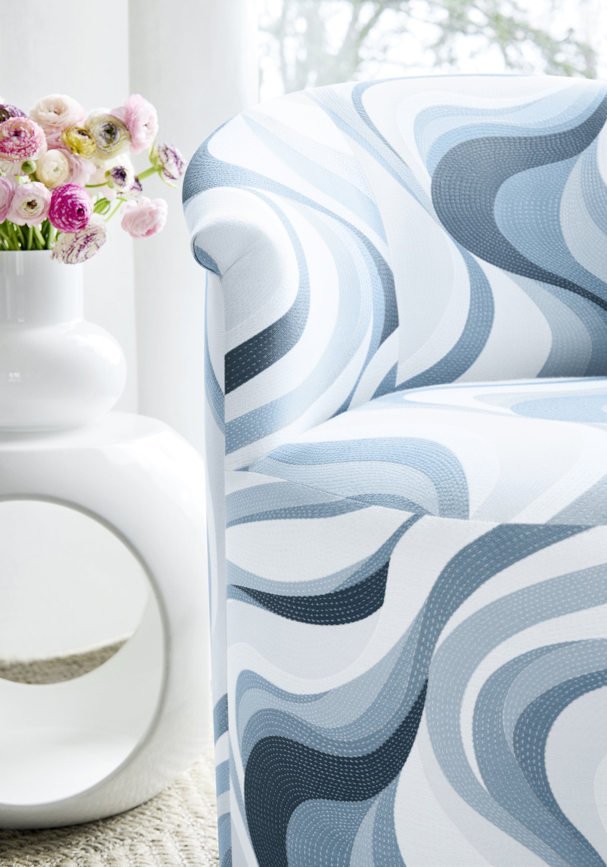 Detail of Ashby Chair with upholstered base in Passage woven fabric in waterfall color - pattern number W74203
