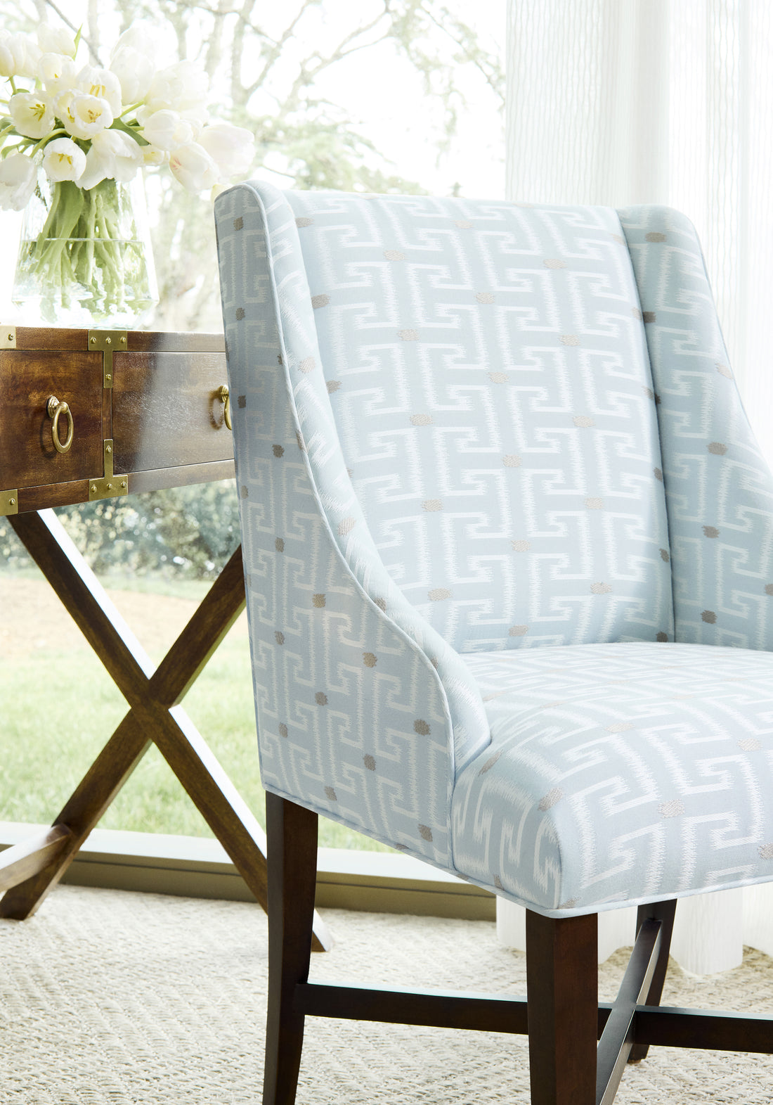 Chair upholstered in Rhodes fabric in glacier color - pattern number W74231 - by Thibaut in the Passage collection