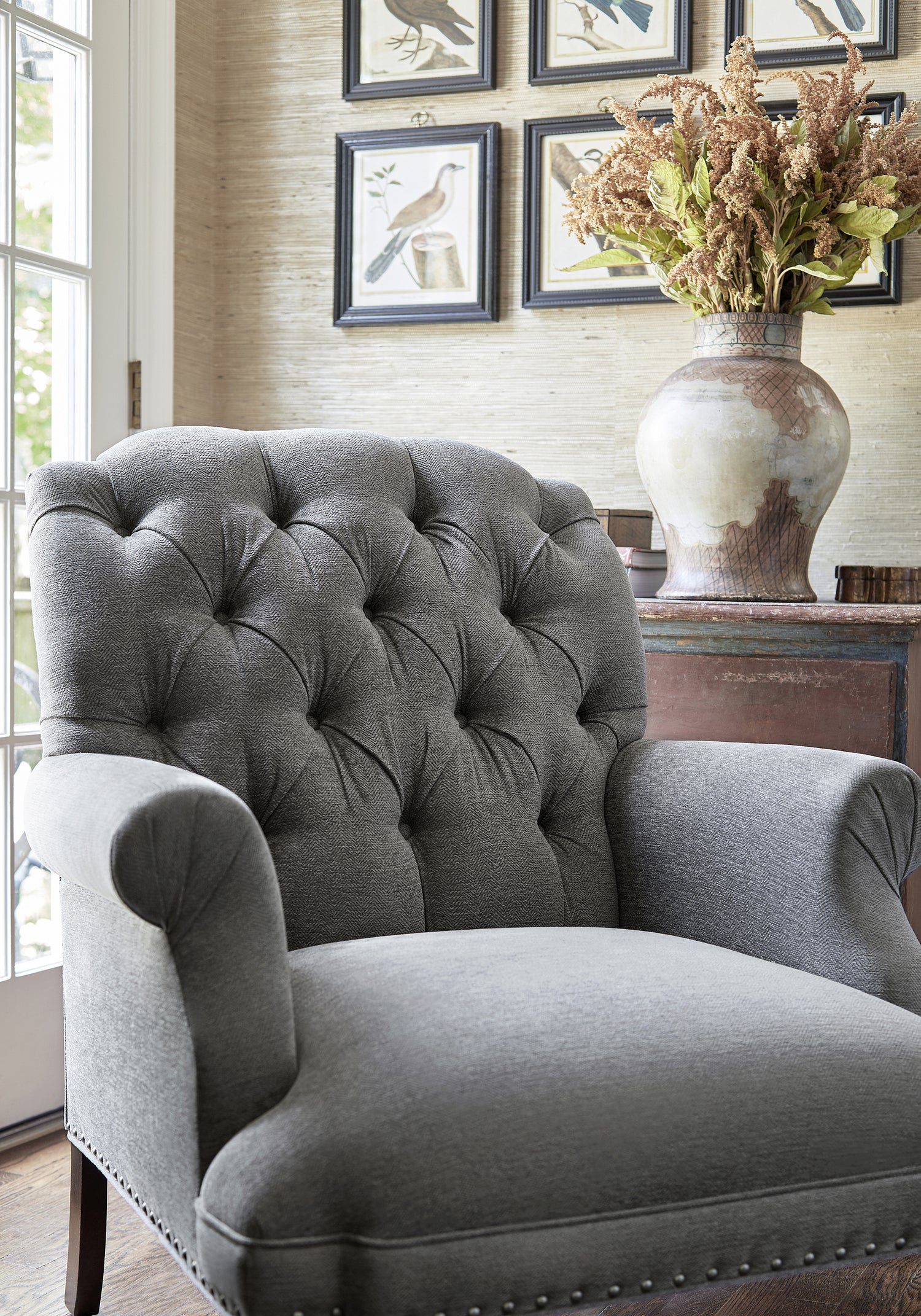 Detailed view of Cheverly Chair in Bronwyn Herringbone woven fabric in charcoal color variant by Thibaut in the Pinnacle collection - pattern number W80685