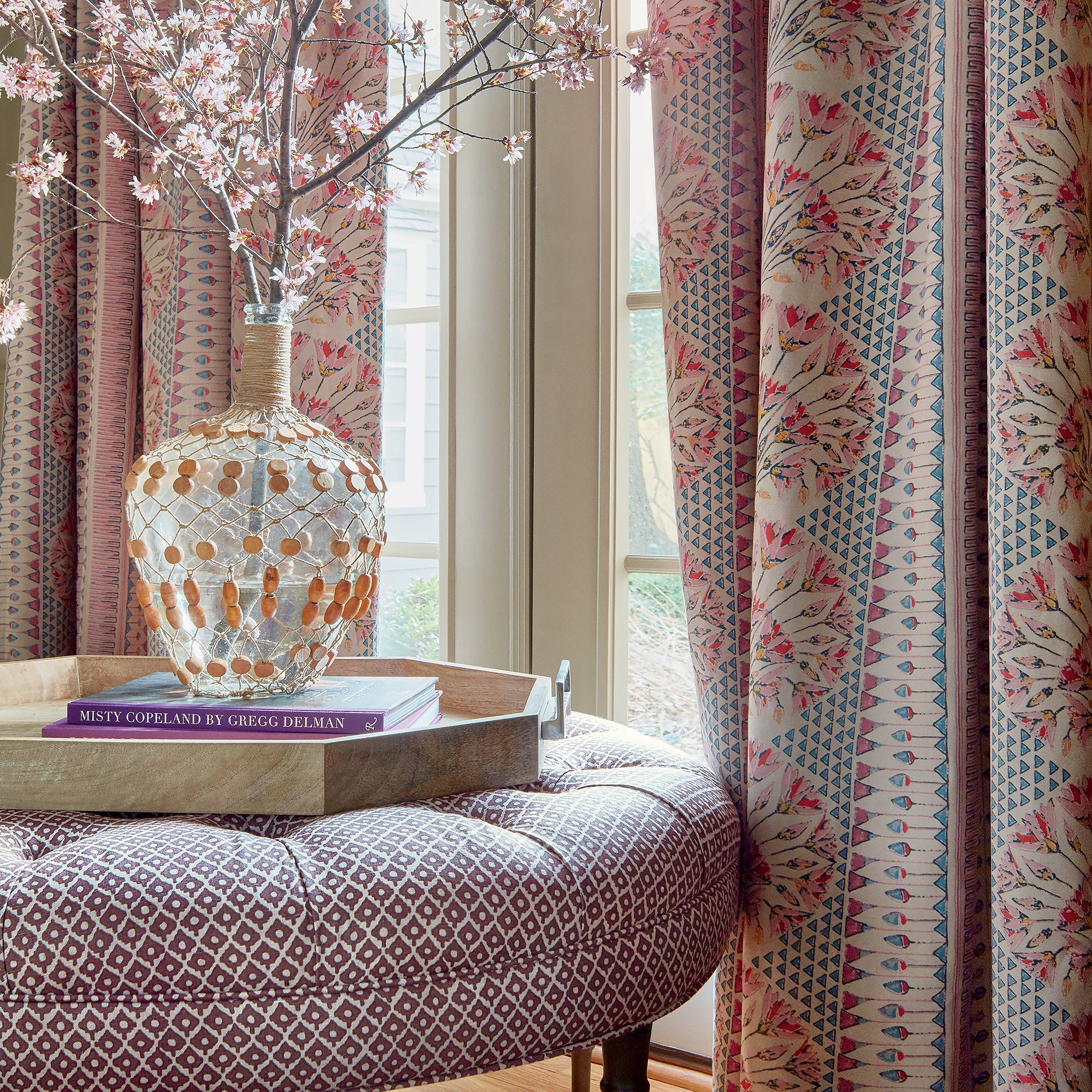 Room with draperies in Cairo printed fabric in Pink and Coral - pattern number AF9625 - by Anna French