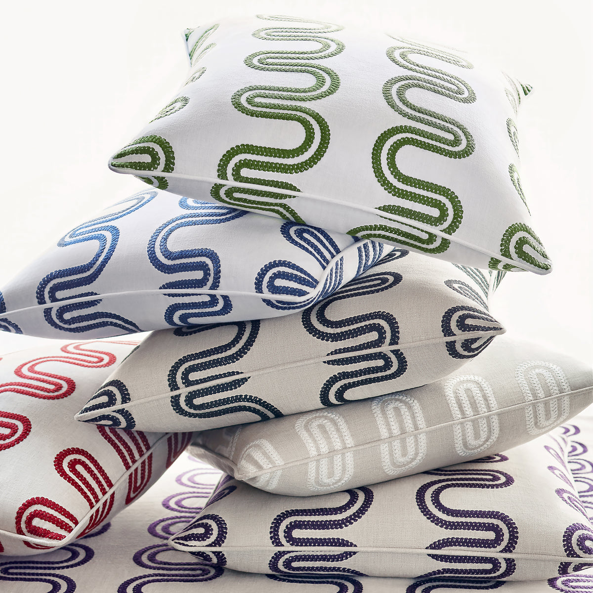 Pillow made with Herriot Way Embroidery fabric in raspberry on flax color - pattern number AF9640 - by Anna French