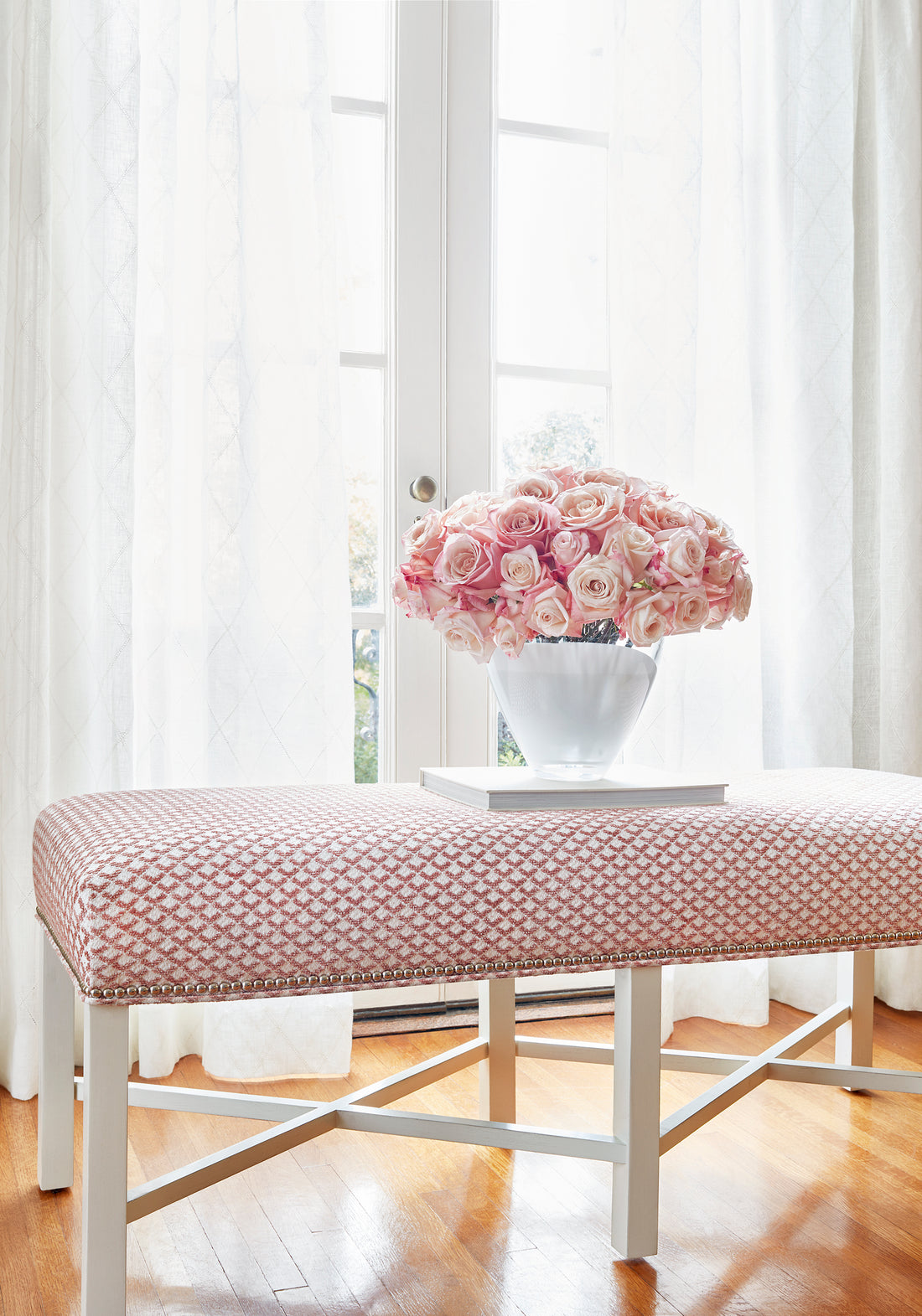 Bellwood Bench in Scala woven fabric in blush color with flower arrangement - pattern number W80727 - by Thibaut in the Woven Resource Vol 11 Rialto collection