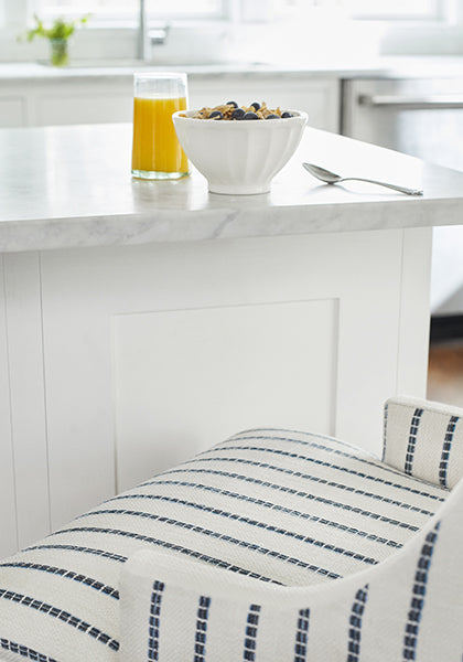 Close up detail of Hudson Counter Stools in Oak Creek Stripe woven fabric in Indigo color - pattern number W78337 - by Thibaut