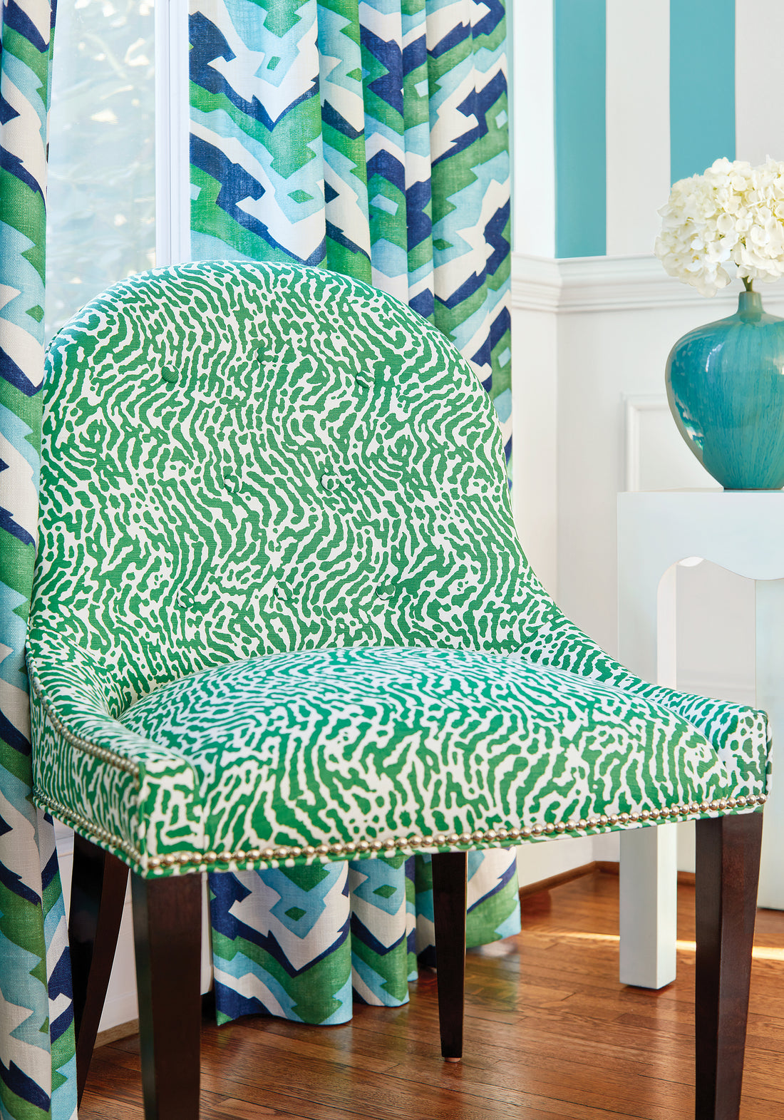 Frontal view of Melrose Chair in St. Croix printed fabric in emerald green color - pattern number F913150 - by Thibaut in the Summer House collection
