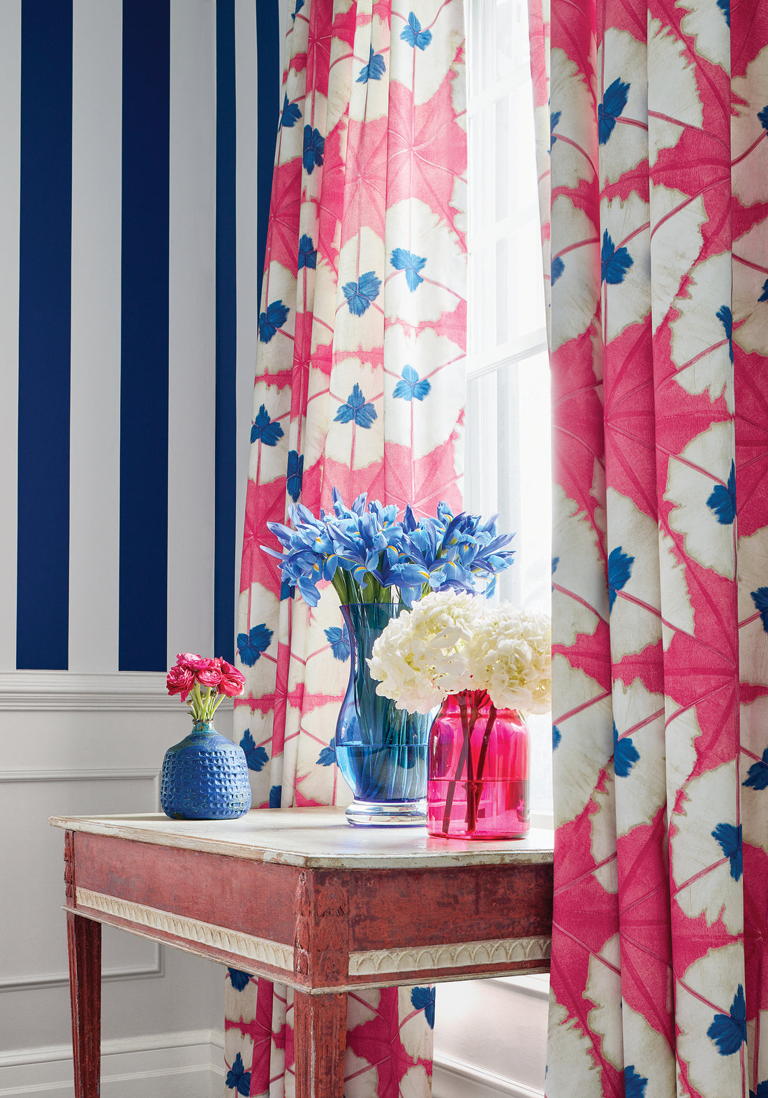 Backdrop of Sunburst printed fabric in pink and blue color - pattern number F913087 by Thibaut in the Summer House collection