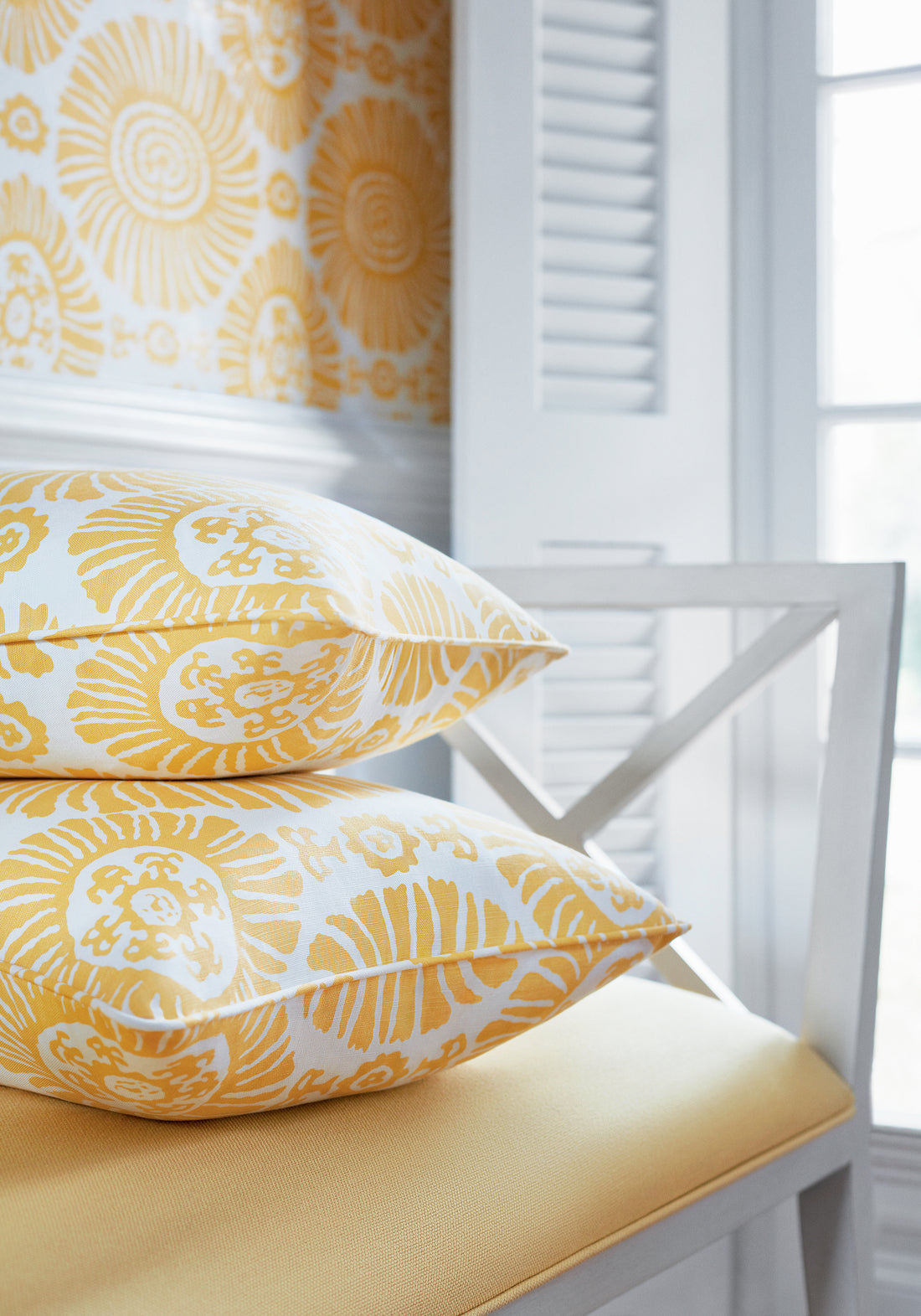 Pillows in Solis printed fabric in yellow color variant by Thibaut in the Tropics collection - pattern number F910086