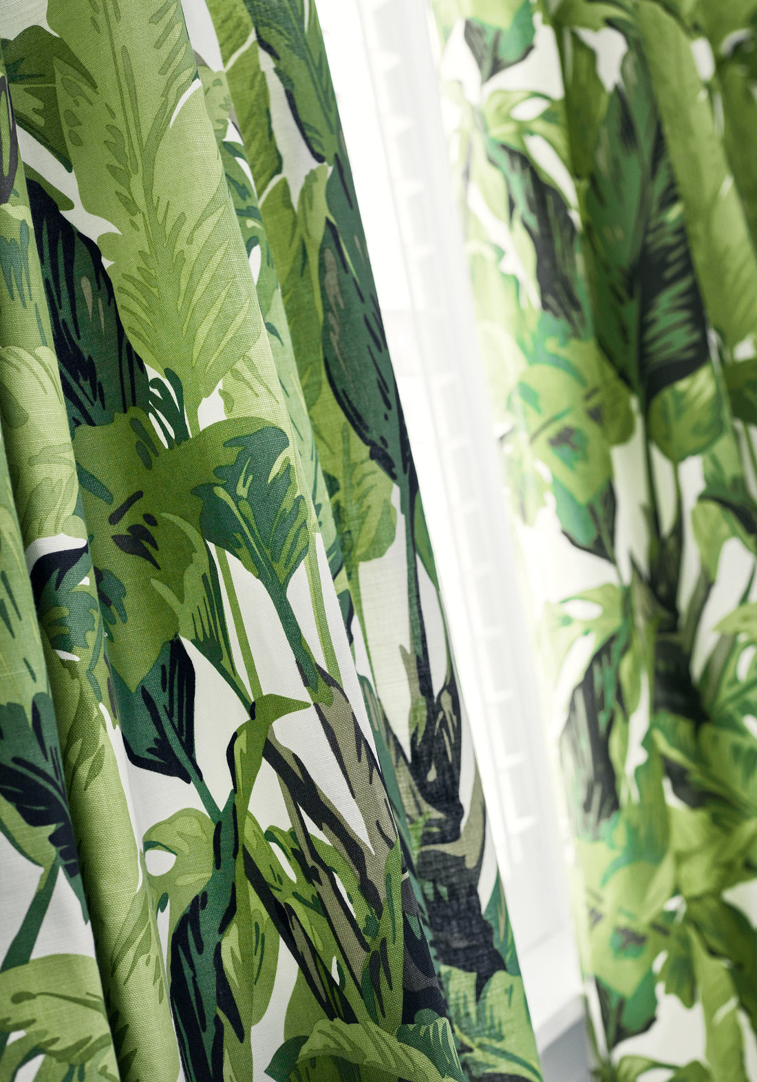 Detailed view of Travelers Palm printed fabric in green color - pattern number F910127 by Thibaut in the Tropics collection