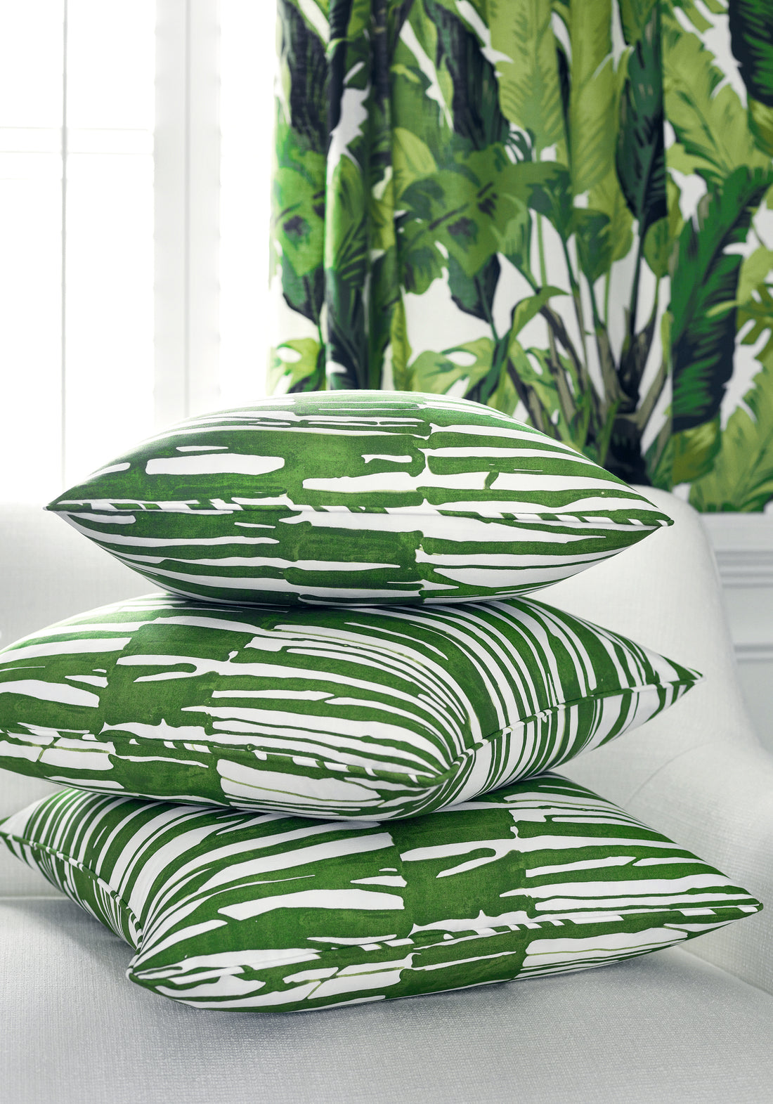 Pillows in Ischia printed fabric in green color variant by Thibaut in the Tropics collection - pattern number F910114